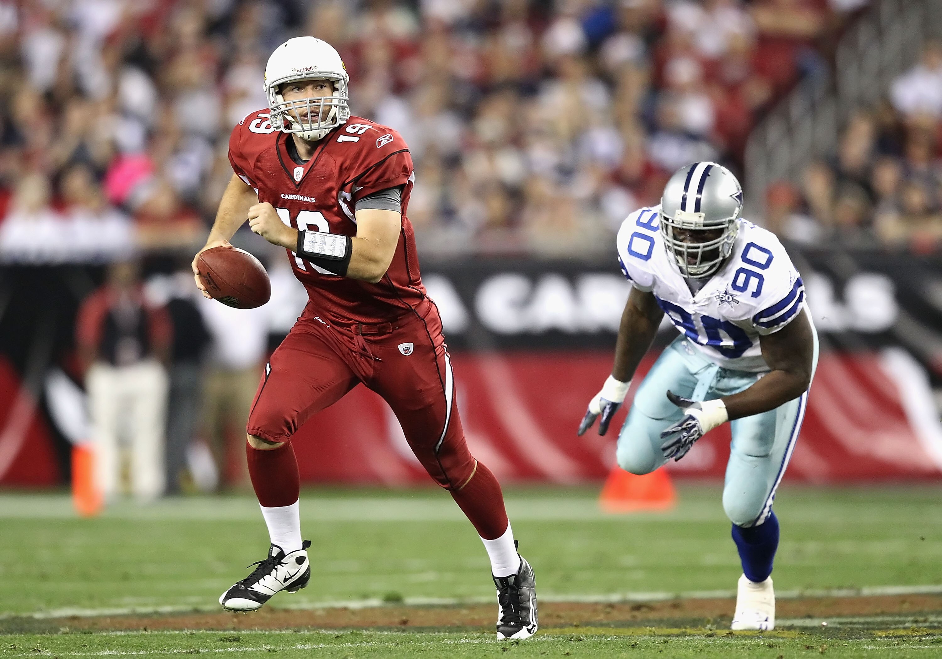 GLENDALE, AZ - DECEMBER 25:  Quarterback John Skelton #19 of the Arizona Cardinals scrambles with the ball past Jay Ratliff #90 of the Dallas Cowboys during the NFL game at the University of Phoenix Stadium on December 25, 2010 in Glendale, Arizona. The C