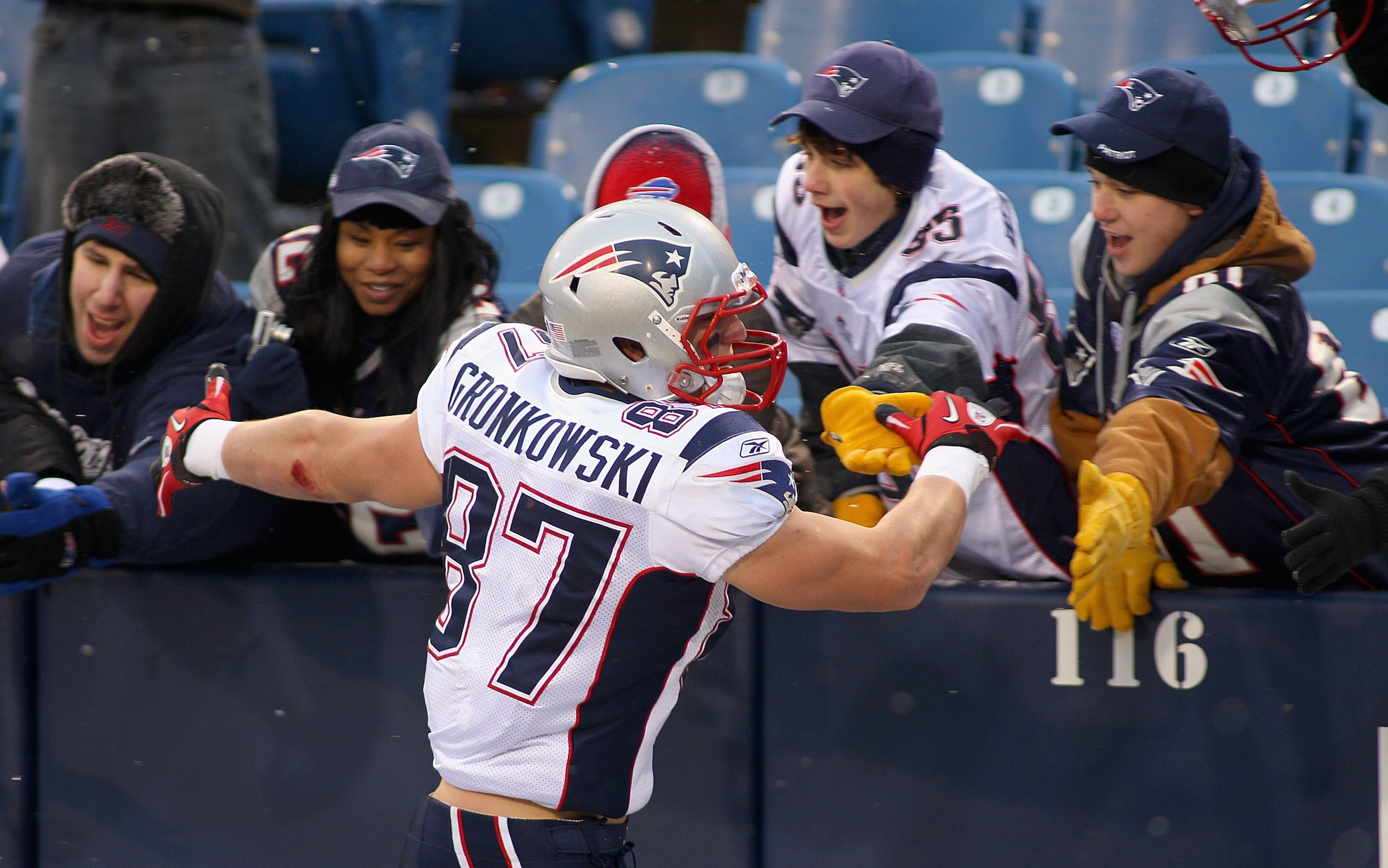 ORCHARD PARK, NY - DECEMBER 26: Rob Gronkowski #87 of the New England Patriots celebrates with fans after playing the Buffalo Bills at Ralph Wilson Stadium on December 26, 2010 in Orchard Park, New York. Gronkowski is a Buffalo native and had two touchdow ORCHARD PARK, NY - DECEMBER 26: Rob Gronkowski #87 of the New England Patriots celebrates with fans after playing the Buffalo Bills at Ralph Wilson Stadium on December 26, 2010 in Orchard Park, New York. Gronkowski is a Buffalo native and had two touchdow
