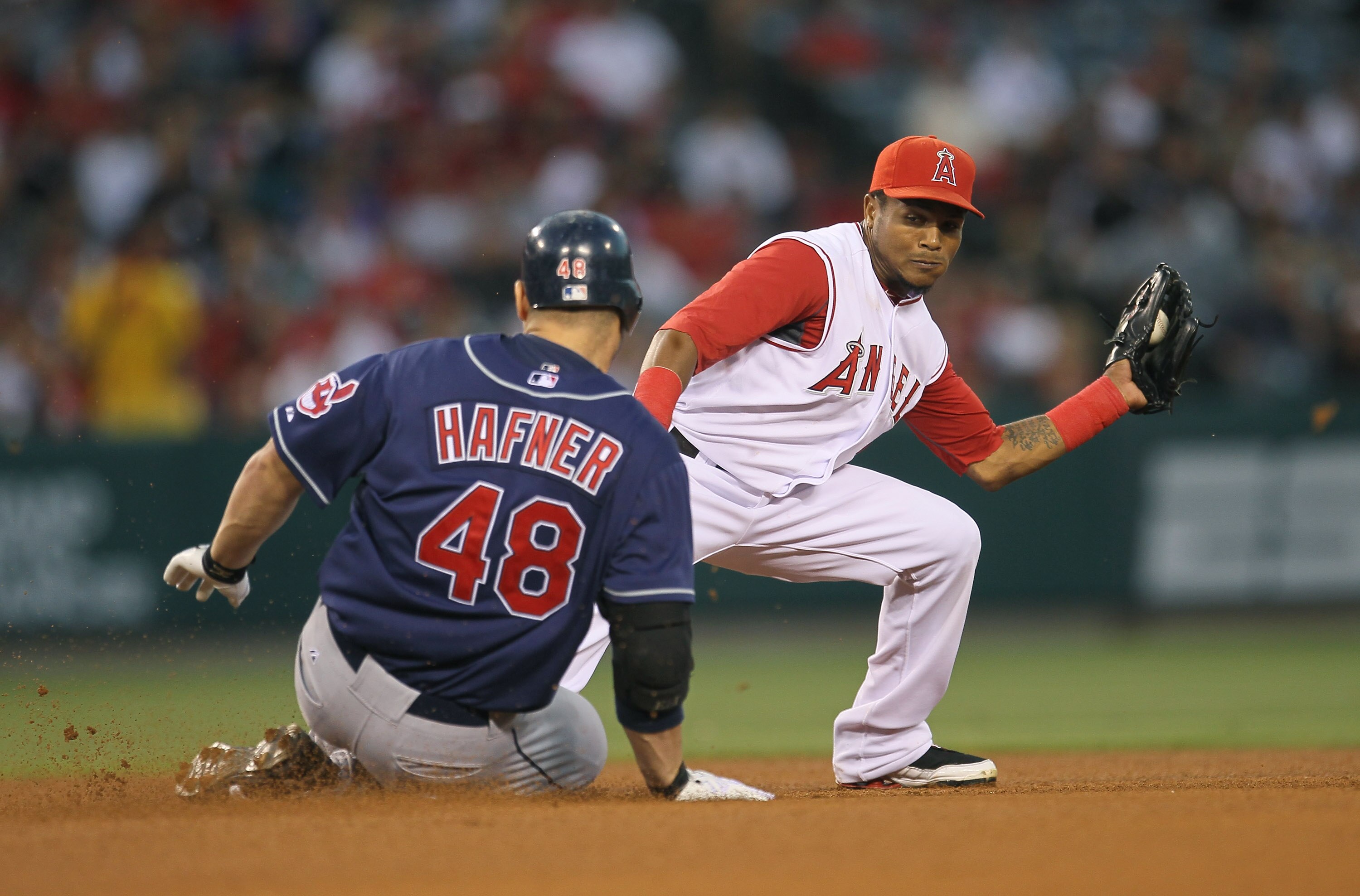 ANAHEIM, CA - SEPTEMBER 06:  Travis Hafner #48 of the Cleveland Indians slides into second with a double  as shortstop Erick Aybar #2 of the Los Angeles Angels of Anaheim takes the throw in the fourth inning on September 6, 2010 at Angel Stadium in Anahei
