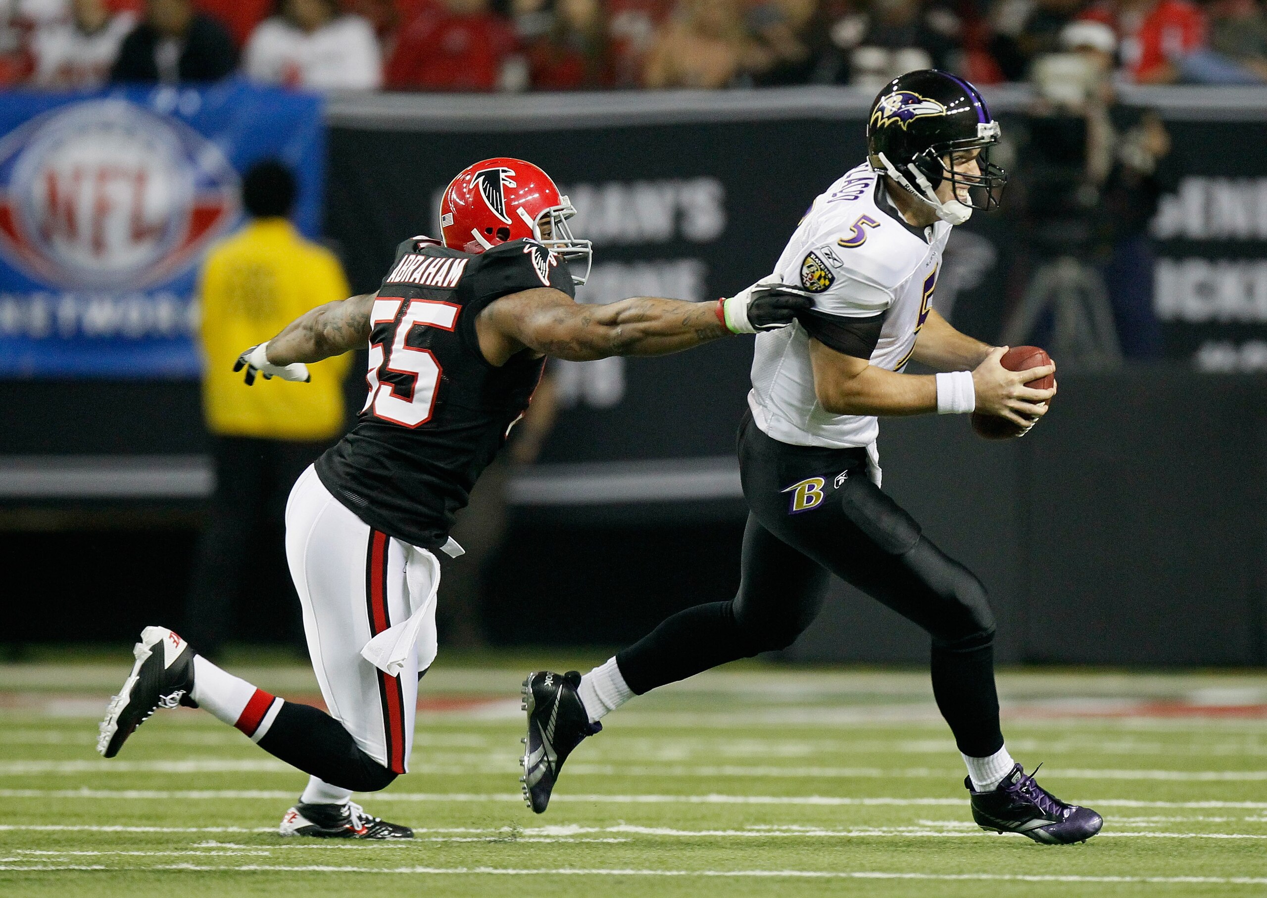 ATLANTA - NOVEMBER 11:  John Abraham #55 of the Atlanta Falcons pressures quarterback Joe Flacco #5 of the Baltimore Ravens at Georgia Dome on November 11, 2010 in Atlanta, Georgia.  (Photo by Kevin C. Cox/Getty Images)