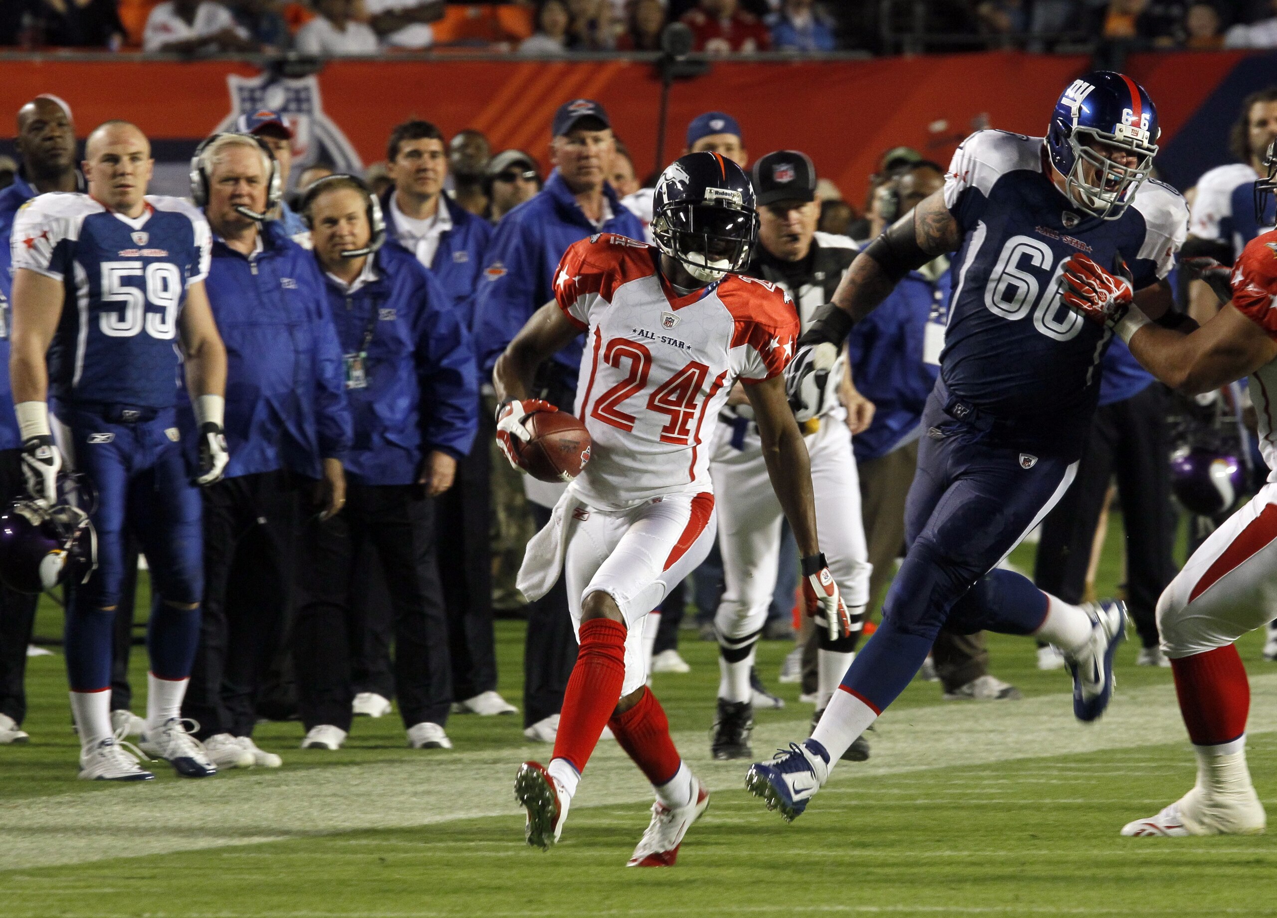 MIAMI GARDENS, FL - JANUARY 31:  Champ Bailey #24 of the AFC runs with the ball for yardage during the 2010 AFC-NFC Pro Bowl game at Sun Life Stadium on January 31, 2010 in Miami Gardens, Florida. The AFC defeated the NFC 41-34. (Photo by Scott Halleran/G