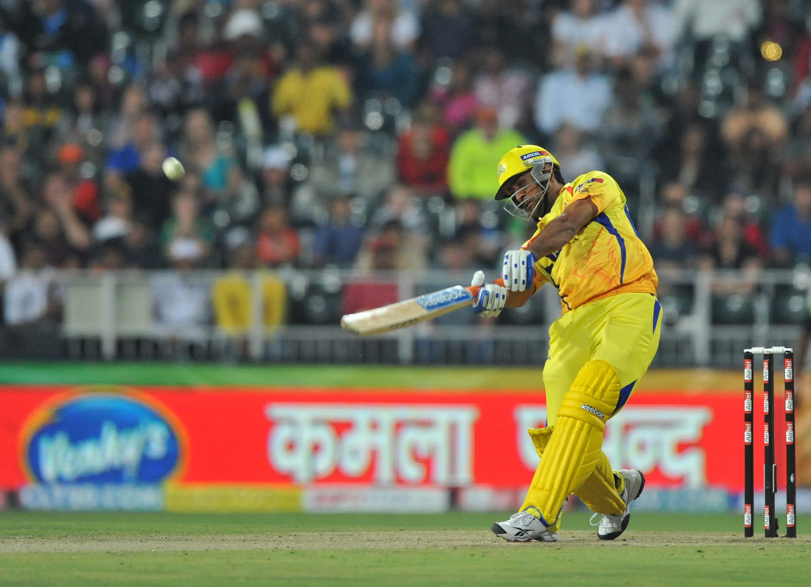 JOHANNESBURG, SOUTH AFRICA - SEPTEMBER 26: Mahendra Singh Dhoni of the Super Kings hits another six during the 2010 Airtel Champions League Twenty20 final match between Chennai Super Kings and Chevrolet Warriors from Bidvest Wanderers Stadium on September