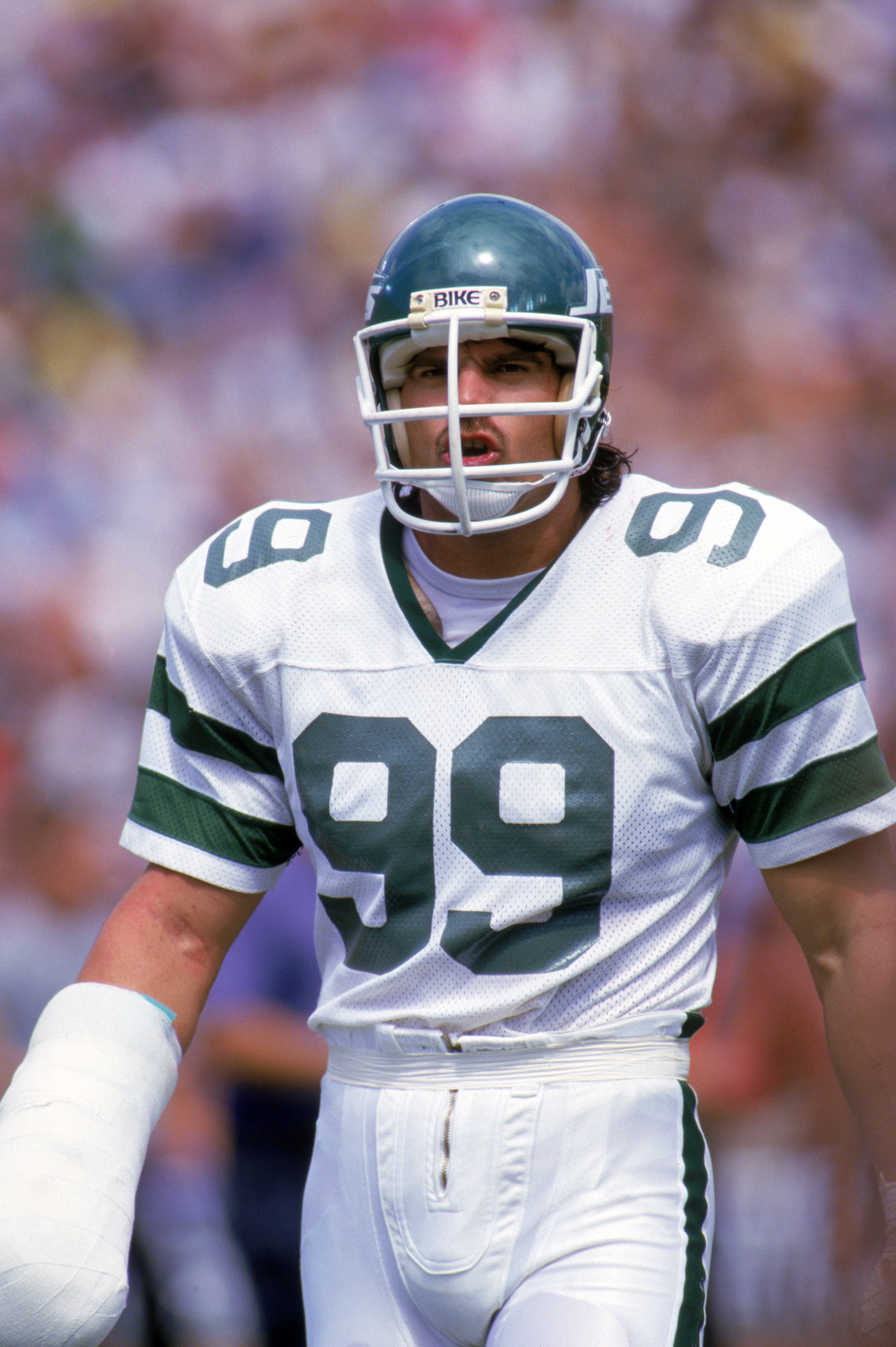 1986:  Defensive end Mark Gastineau #99 of the New York Jets walks on the field during a game in 1986.  (Photo by Rick Stewart/Getty Images)