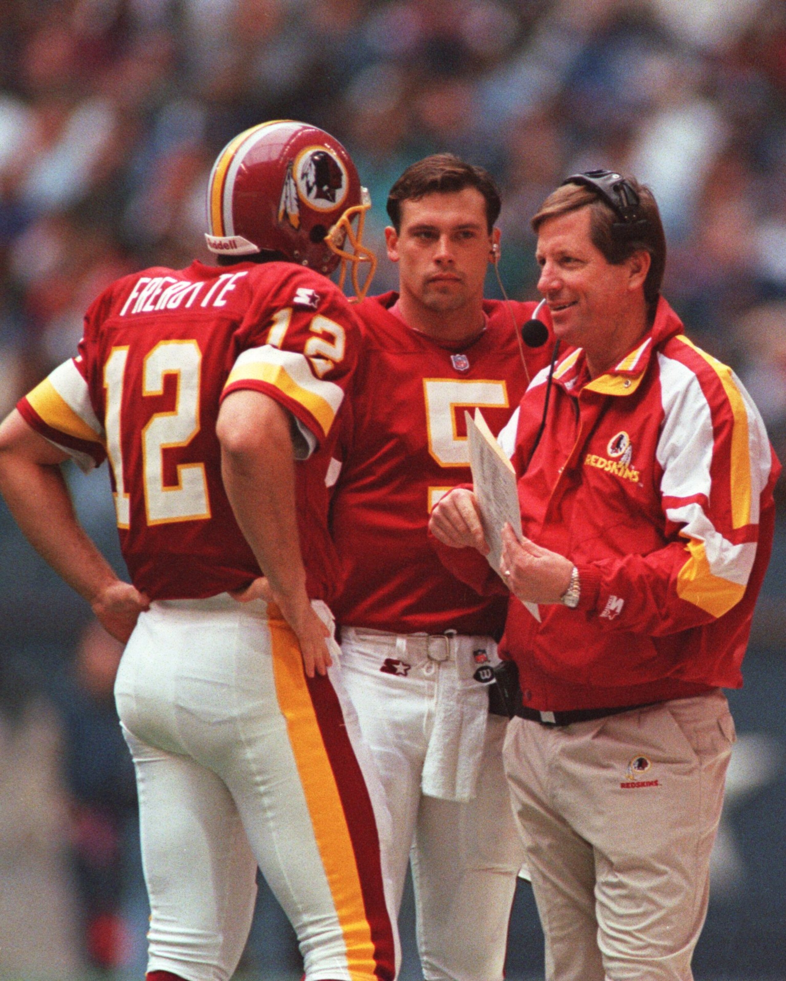 28 Nov 1996: Head coach Norv Turner (right) talks with quarterbacks Gus Frerotte (left) and Heath Shuler (middle) of the Washington Redskins during a 21-10 loss to the Dallas Cowboys at Texas Stadium in Irving, Texas.