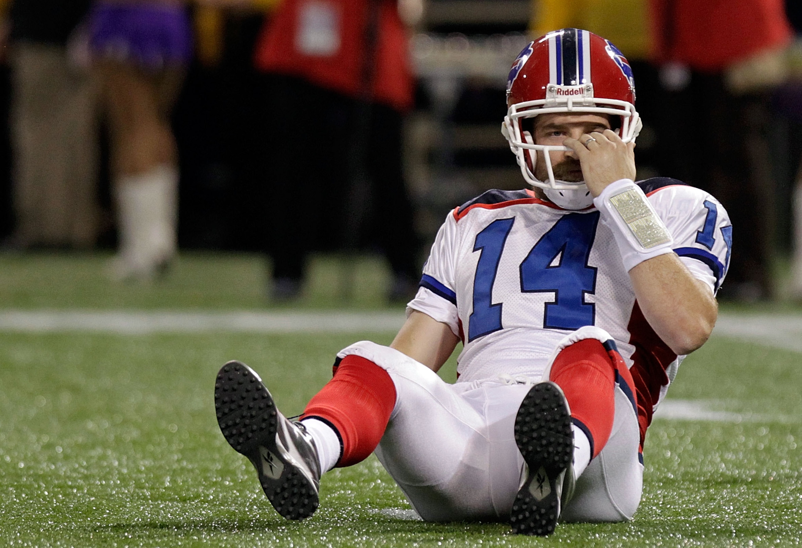 MINNEAPOLIS, MN - DECEMBER 05:  Ryan Fitzpatrick #14 of the Buffalo Bills picks himself up after being sacked against the Minnesota Vikings at the Mall of America Field at the Hubert H. Humphrey Metrodome on December 5, 2010 in Minneapolis, Minnesota.  (P