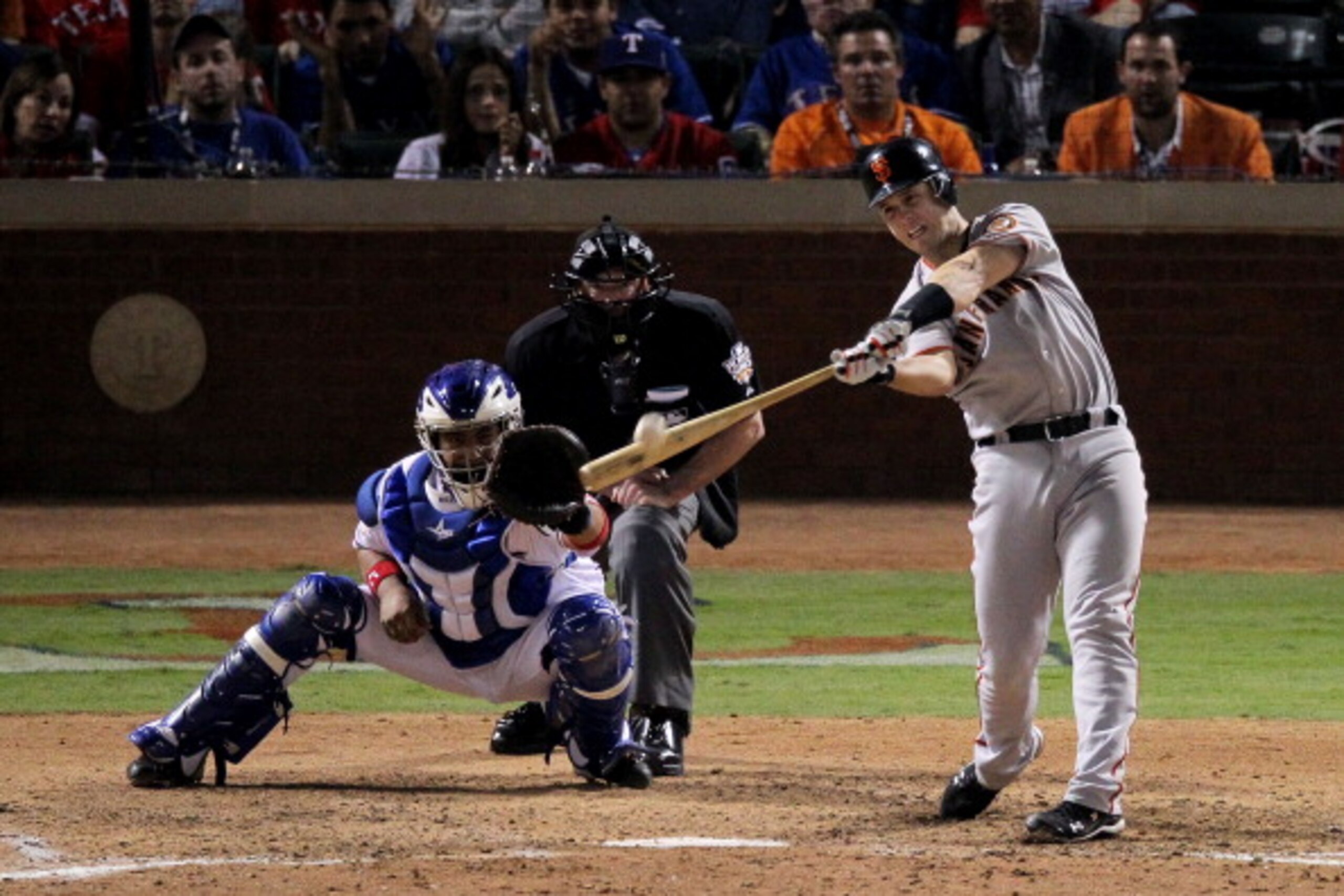 ARLINGTON, TX - OCTOBER 31:  Buster Posey #28 of the San Francisco Giants hits a home run against the Texas Rangers during the top of the eighth inning in Game Four of the 2010 MLB World Series at Rangers Ballpark in Arlington on October 31, 2010 in Arlin