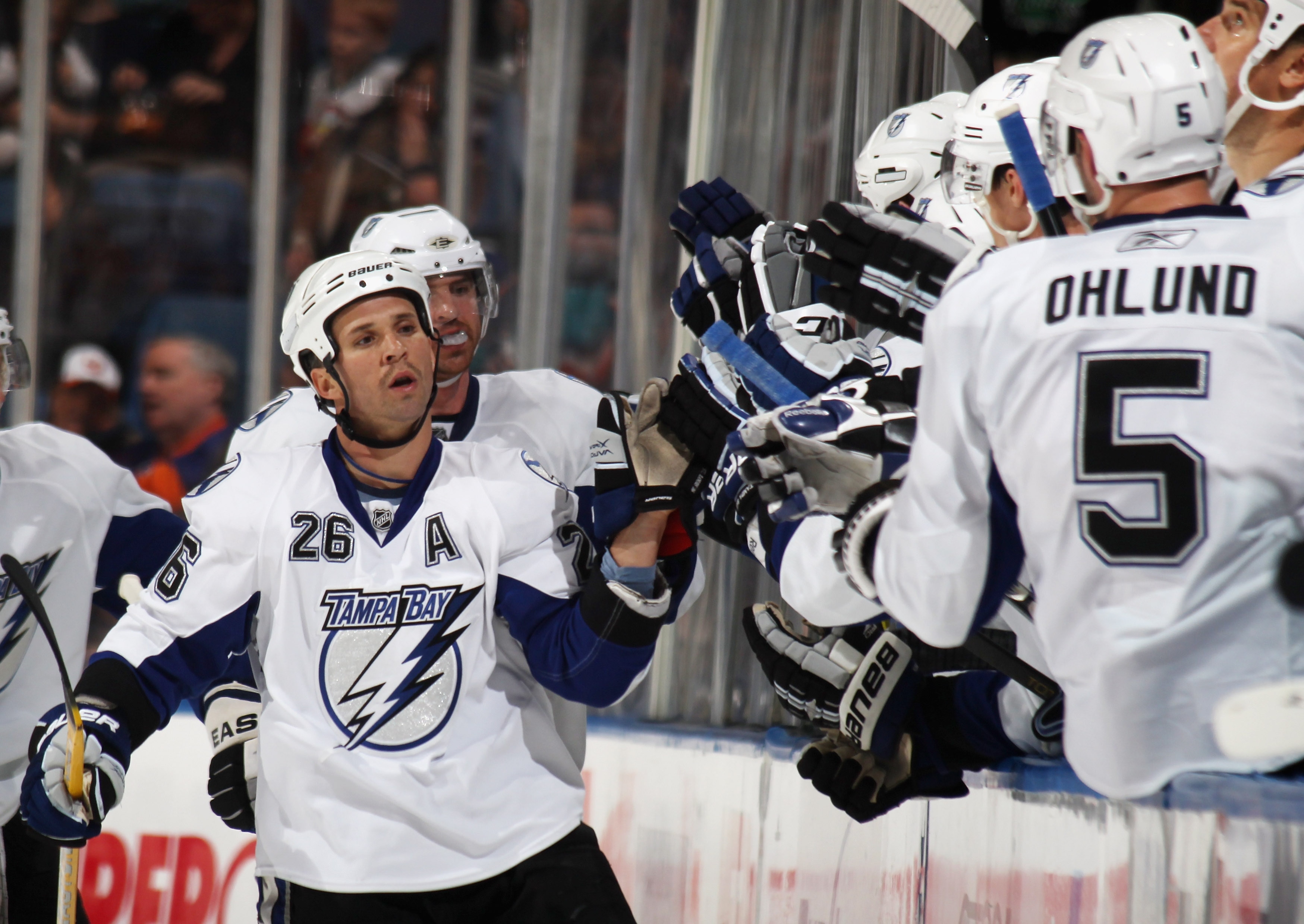 UNIONDALE, NY - NOVEMBER 17: Martin St. Louis #26 of the Tampa Bay Lightning celebrates a second period goal by Brett Clark #7 (not shown) in his game against the New York Islanders the Nassau Coliseum on November 17, 2010 in Uniondale, New York.  (Photo