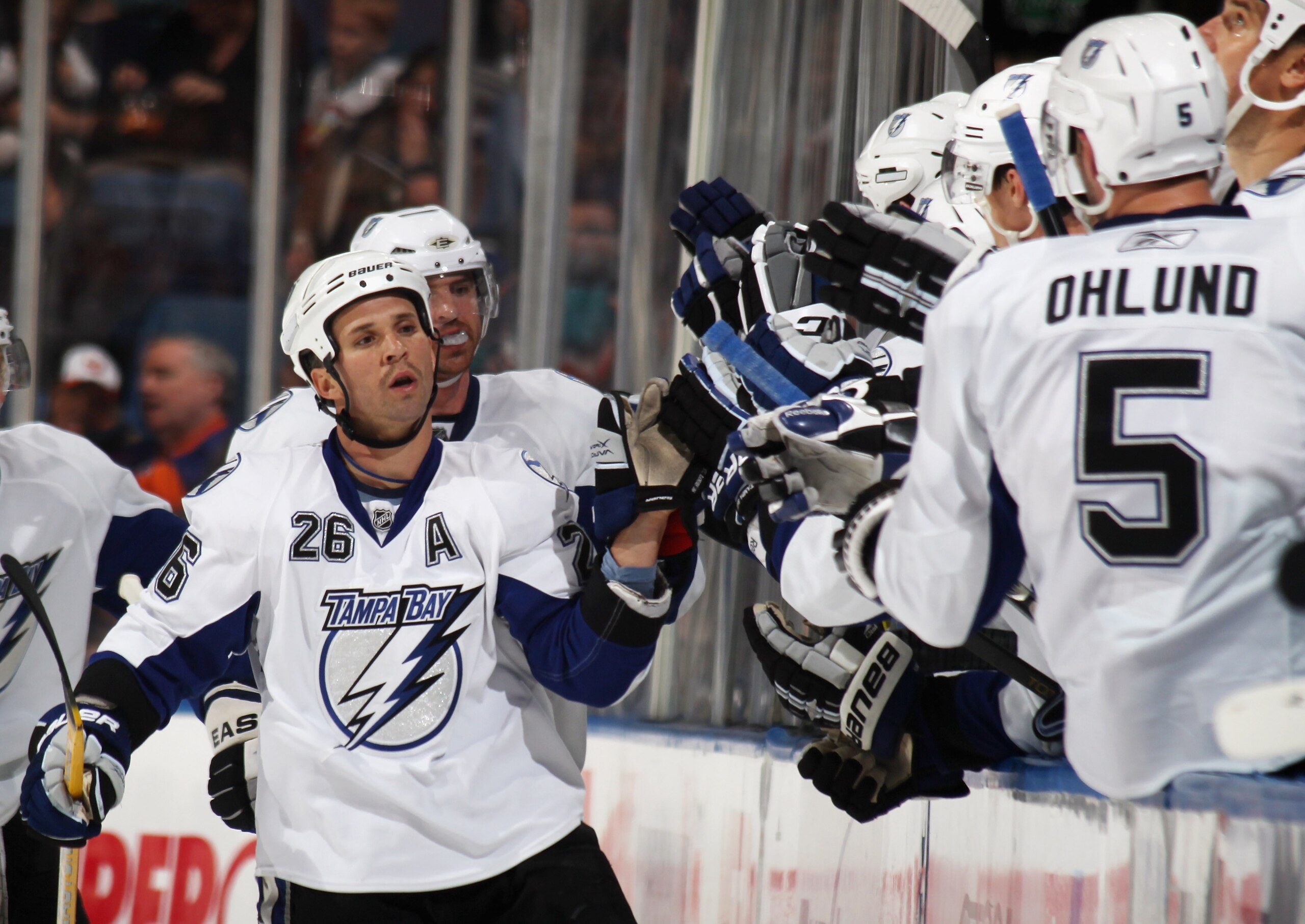 UNIONDALE, NY - NOVEMBER 17: Martin St. Louis #26 of the Tampa Bay Lightning celebrates a second period goal by Brett Clark #7 (not shown) in his game against the New York Islanders the Nassau Coliseum on November 17, 2010 in Uniondale, New York.  (Photo