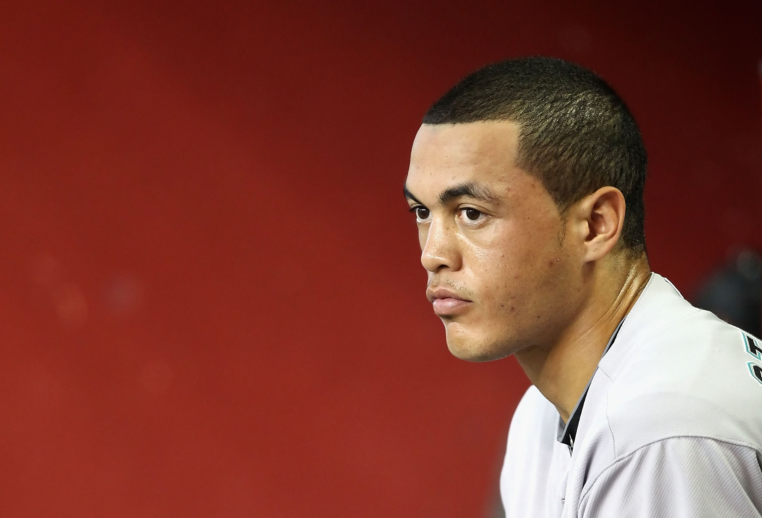 PHOENIX - JULY 10:  Mike Stanton #27 of the Florida Marlins in the dugout during the Major League Baseball game against the Arizona Diamondbacks at Chase Field on July 10, 2010 in Phoenix, Arizona.  The Diamondbacks defeated the Marlins 5-4.  (Photo by Ch