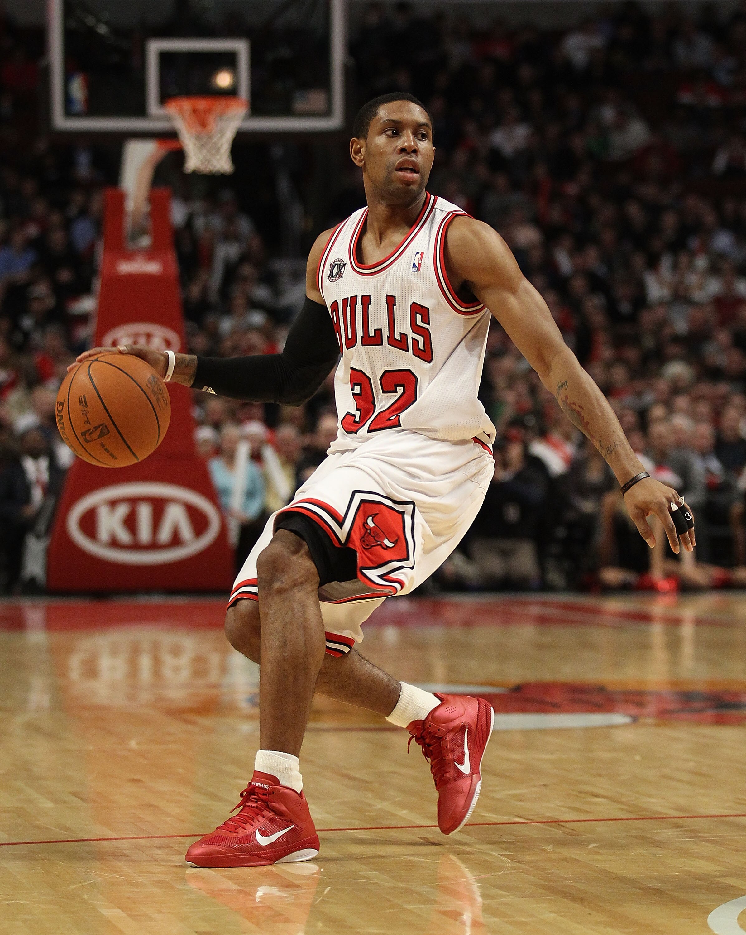 CHICAGO, IL - DECEMBER 21: C.J. Watson #32 of the Chicago Bulls looks to pass against the Philadelphia 76ers at the United Center on December 21, 2010 in Chicago, Illinois. The Bulls defeated the 76ers 121-76. NOTE TO USER: User expressly acknowledges and