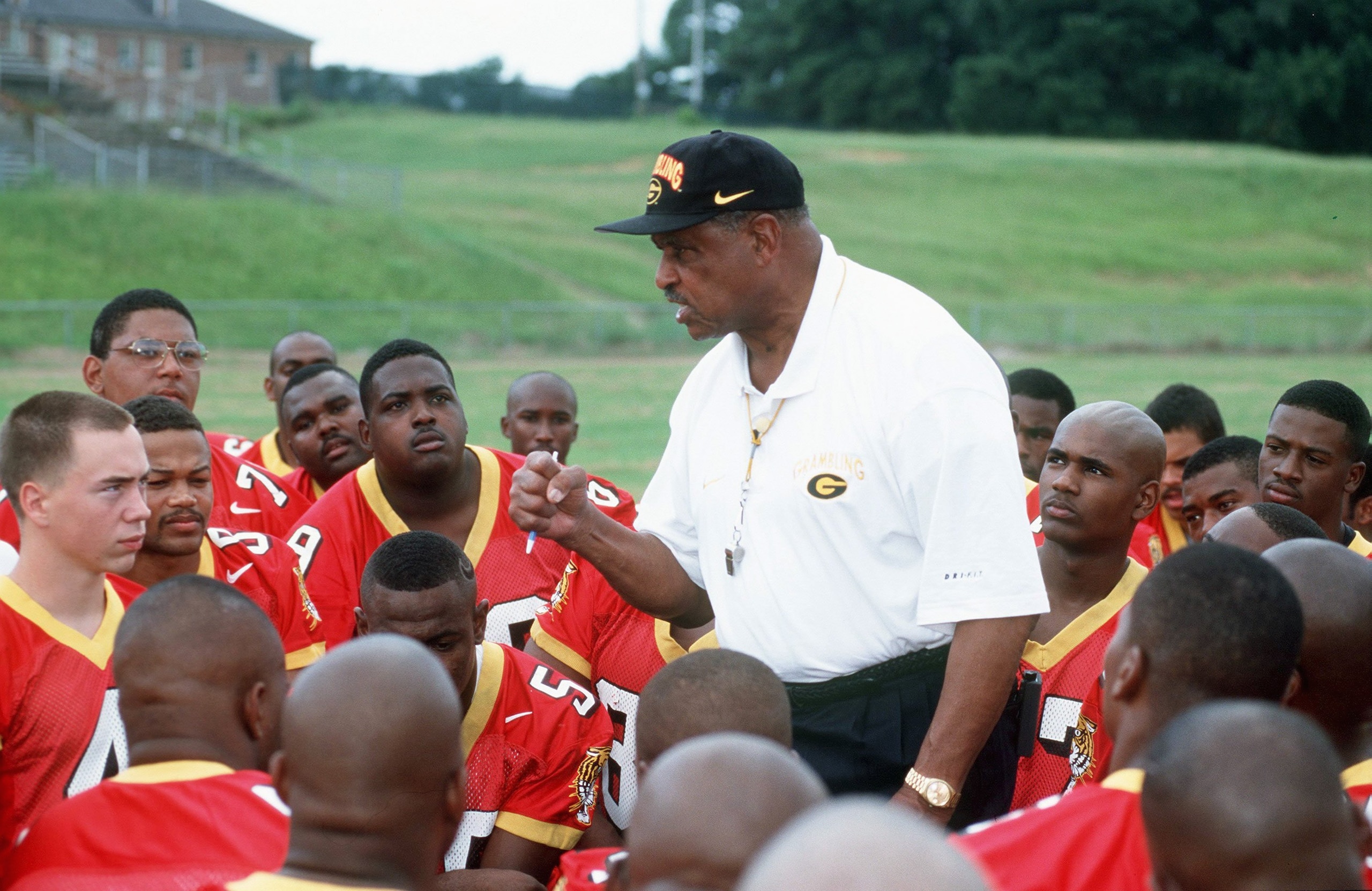 GRAMBLING,LA - AUGUST 13:  Head Coach Eddie Robinson of Grambling State University talks with his team during Media Day at Robinson Stadium in Grambling, Louisiana.  (Photo by: Stephen Dunn/Getty Images)