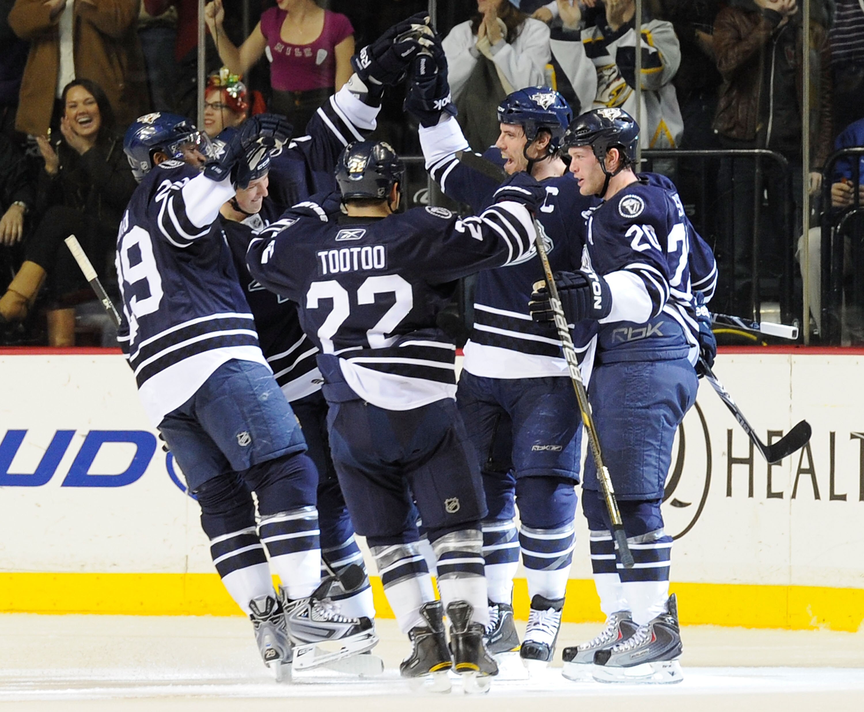 NASHVILLE, TN - DECEMBER 11:  Joel Ward #29, Jerred Smithson #25, Jordin Tootoo #22, and Ryan Suter #20 of the Nashville Predators congratulate teammate Shea Weber #6 on scoring a goal against the Florida Panthers on December 11, 2010 at the Bridgestone A
