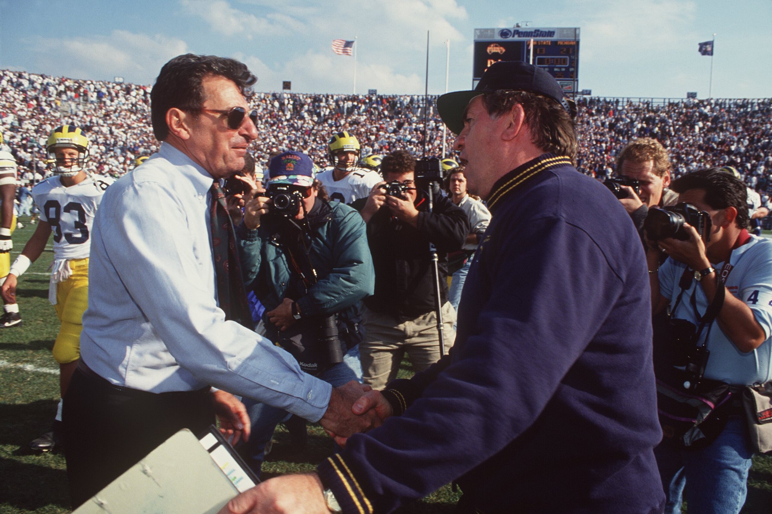 16 Oct 1993: PENN STATE HEAD COACH JOE PATERNO SHAKES HANDS WITH MICHIGAN HEAD COACH GARY MOELLER AFTER THE NITTANY LIONS LOST TO THE WOLVERINES 21-13 AT BEAVER STADIUM IN STATE COLLEGE, PA.
