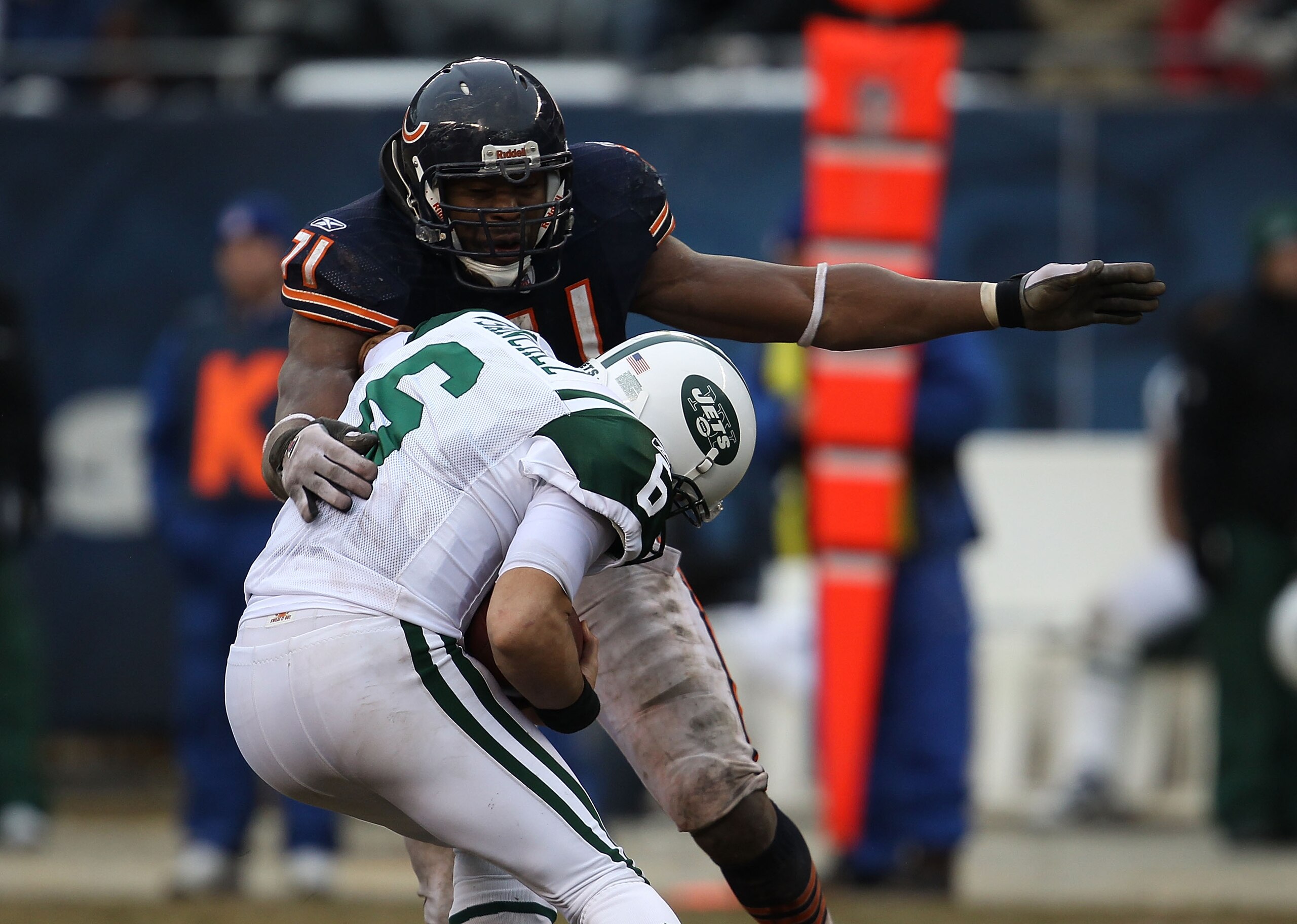 CHICAGO, IL - DECEMBER 26: Mark Sanchez #6 of the New York Jets tries to escape from Israel Idonije #71 of the Chicago Bears at Soldier Field on December 26, 2010 in Chicago, Illinois. The Bears defeated the Jets 38-34. (Photo by Jonathan Daniel/Getty Ima