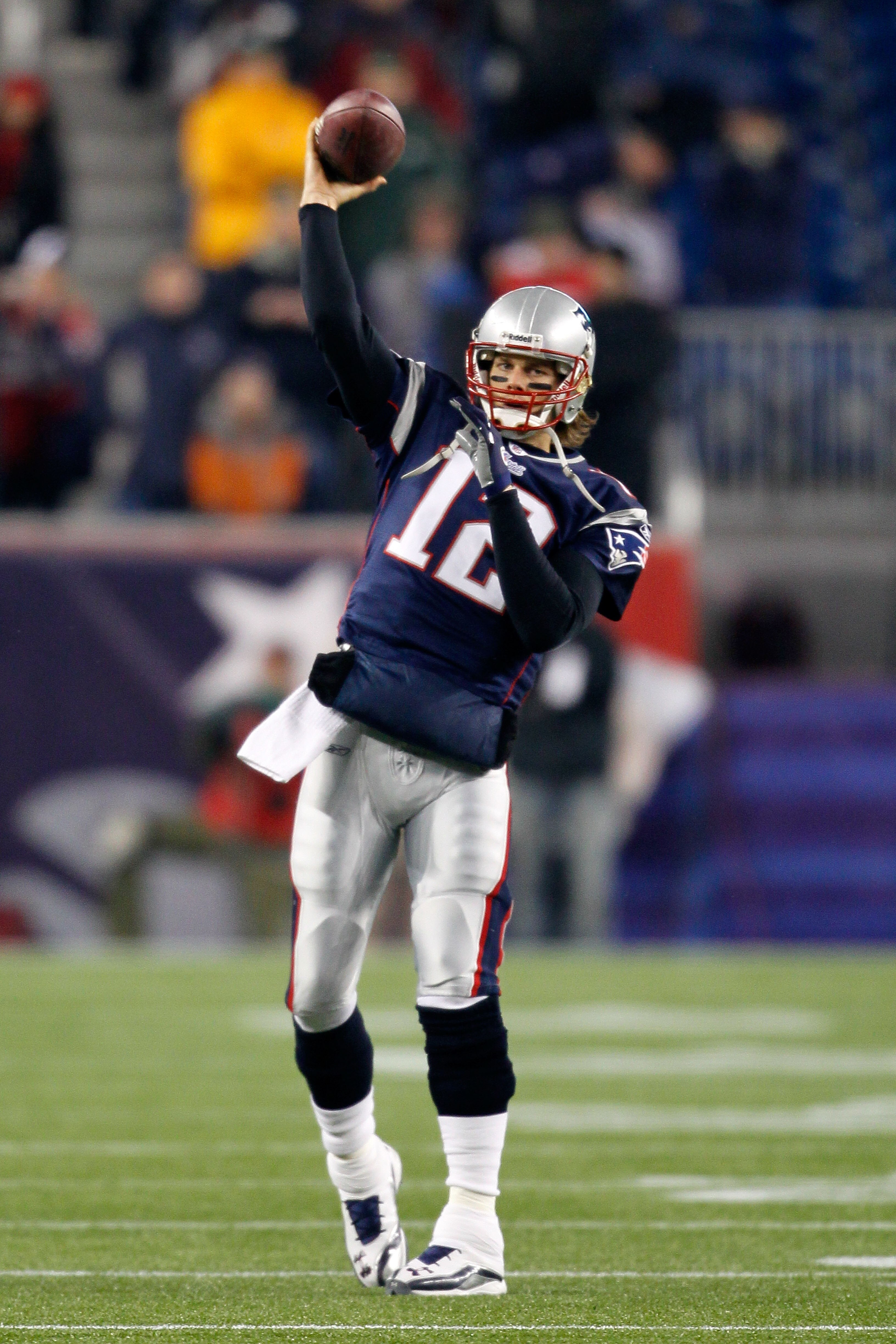 FOXBORO, MA - DECEMBER 19:  Quarterback Tom Brady #12 of the New England Patriots throws a pass during warm-ups before playing against the Green Bay Packers at Gillette Stadium on December 19, 2010 in Foxboro, Massachusetts.  (Photo by Jim Rogash/Getty Im