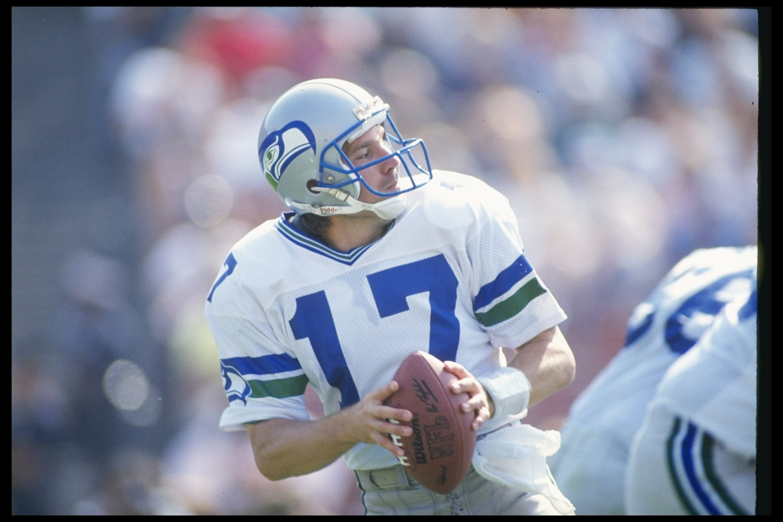 14 Oct 1990: Quarterback Dave Krieg of the Seattle Seahawks looks to pass the ball during a game against the Los Angeles Raiders at the Los Angeles Memorial Coliseum in Los Angeles, California. The Raiders won the game, 24-17.