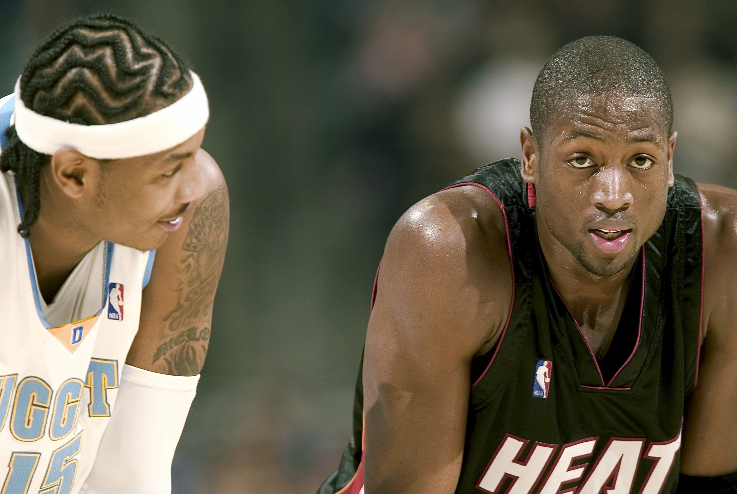 DENVER - DECEMBER 3:  Carmelo Anthony #15 of the Denver Nuggets talks with Dwyane Wade #3 of the Miami Heat in the fourth quarter  December 3, 2005 at the Pepsi Center in Denver, Colorado. The Nuggets won 101-99.   NOTE TO USER: User expressly acknowledge