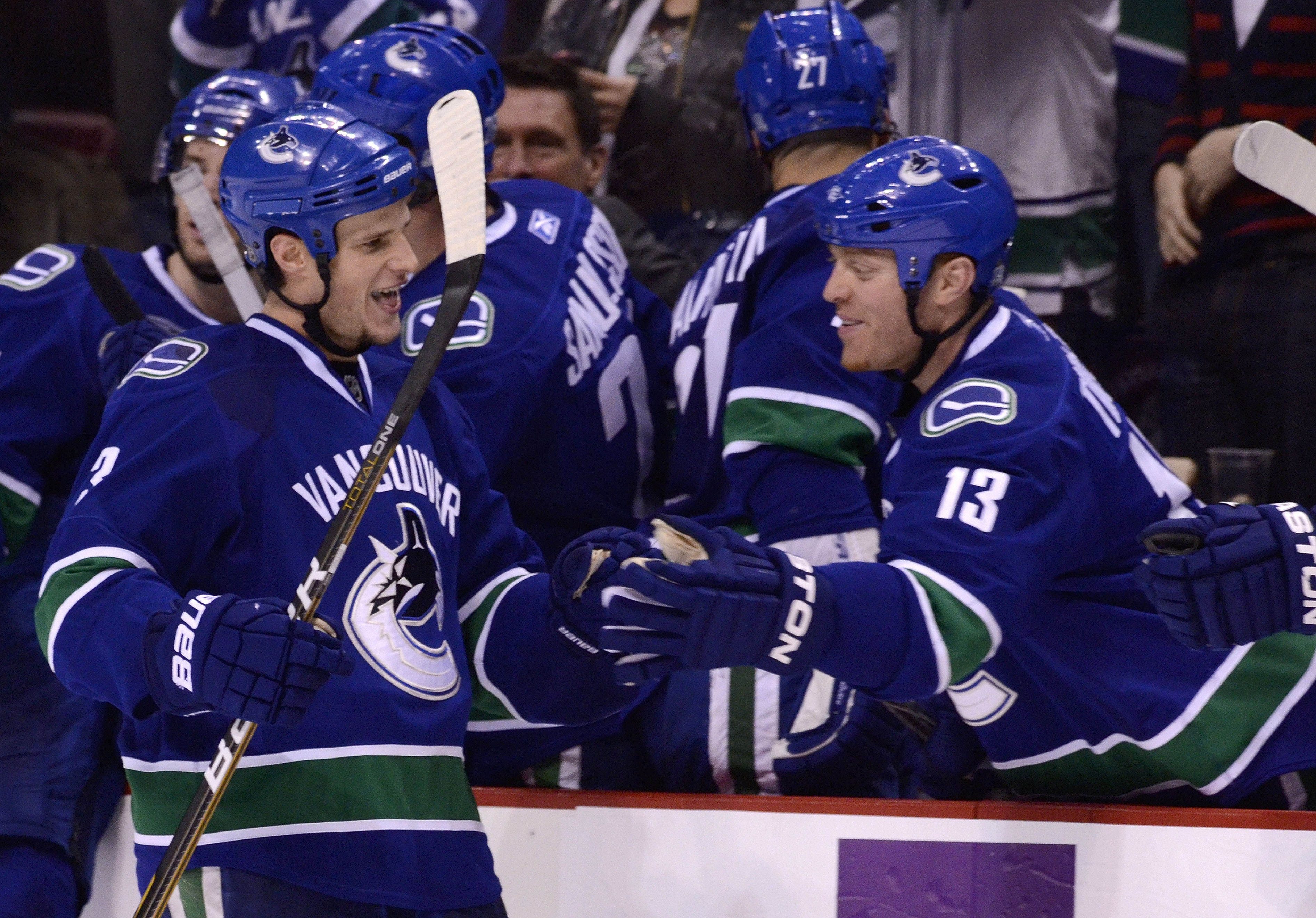 VANCOUVER, CANADA - DECEMBER 26: Kevin Bieksa #3 of the Vancouver Canucks is congratulated by Raffi Torres #13 after scoring what proved to be the game winning goal in a 3-2 win against the Edmonton Oilers during the third period in NHL action on December