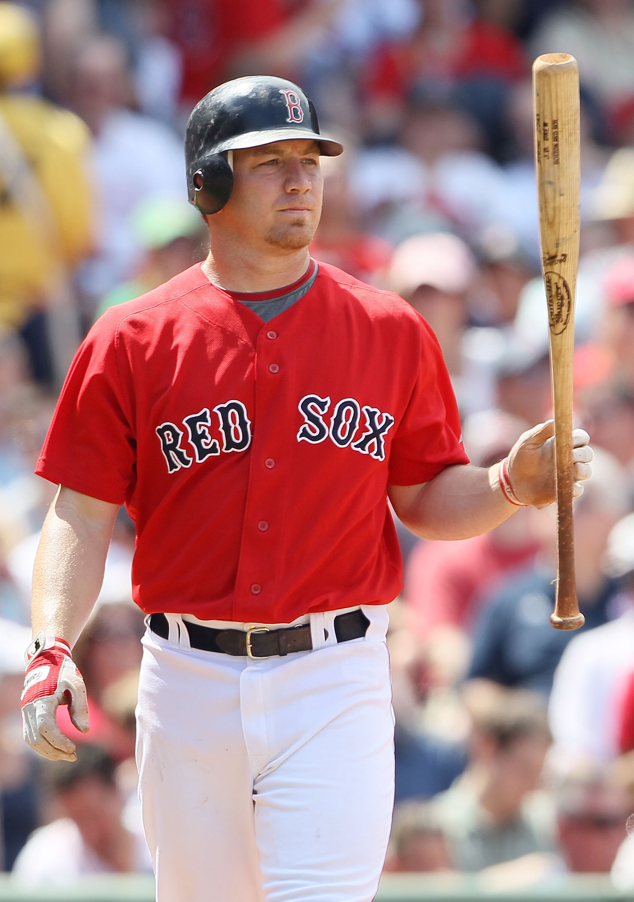 BOSTON - JULY 04:  J.D. Drew #7 of the Boston Red Sox heads back to the dugout after he struck out against the Baltimore Orioles on July 4, 2010 at Fenway Park in Boston, Massachusetts.  (Photo by Elsa/Getty Images)
