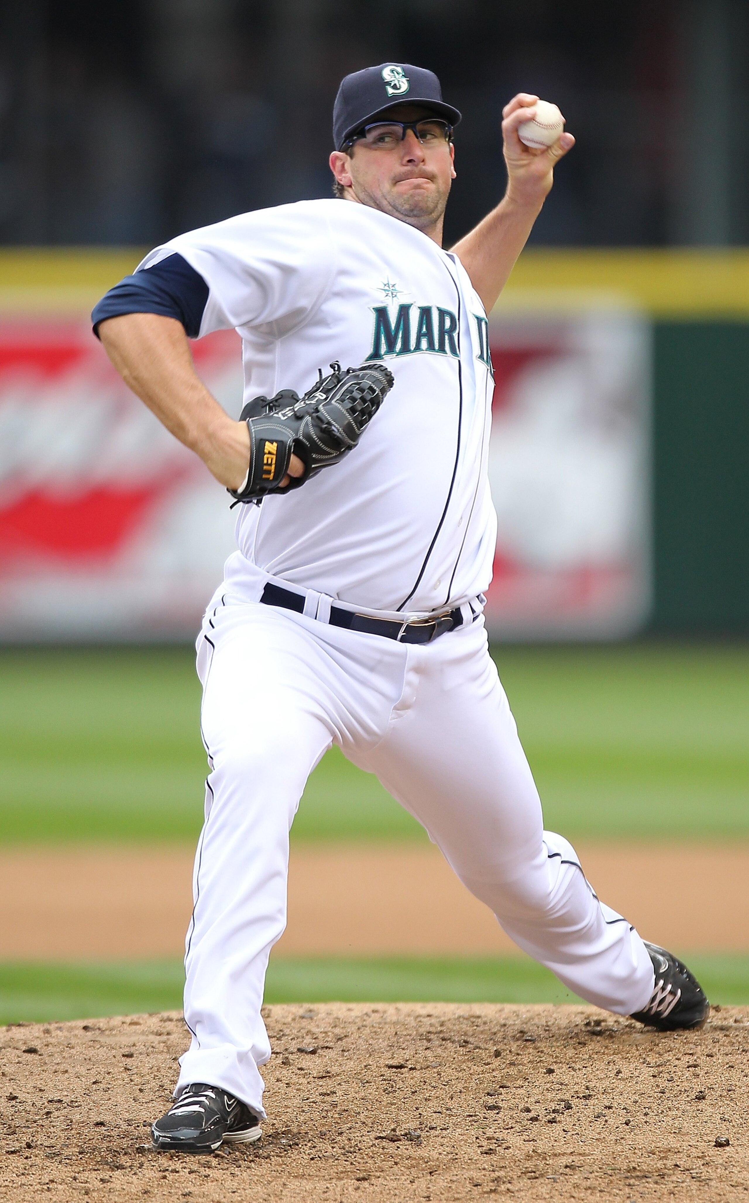 SEATTLE - APRIL 12:  Starting pitcher Ryan Rowland-Smith #18 of the Seattle Mariners pitches against the Oakland Athletics during the Mariners' home opener at Safeco Field on April 12, 2010 in Seattle, Washington. (Photo by Otto Greule Jr/Getty Images)