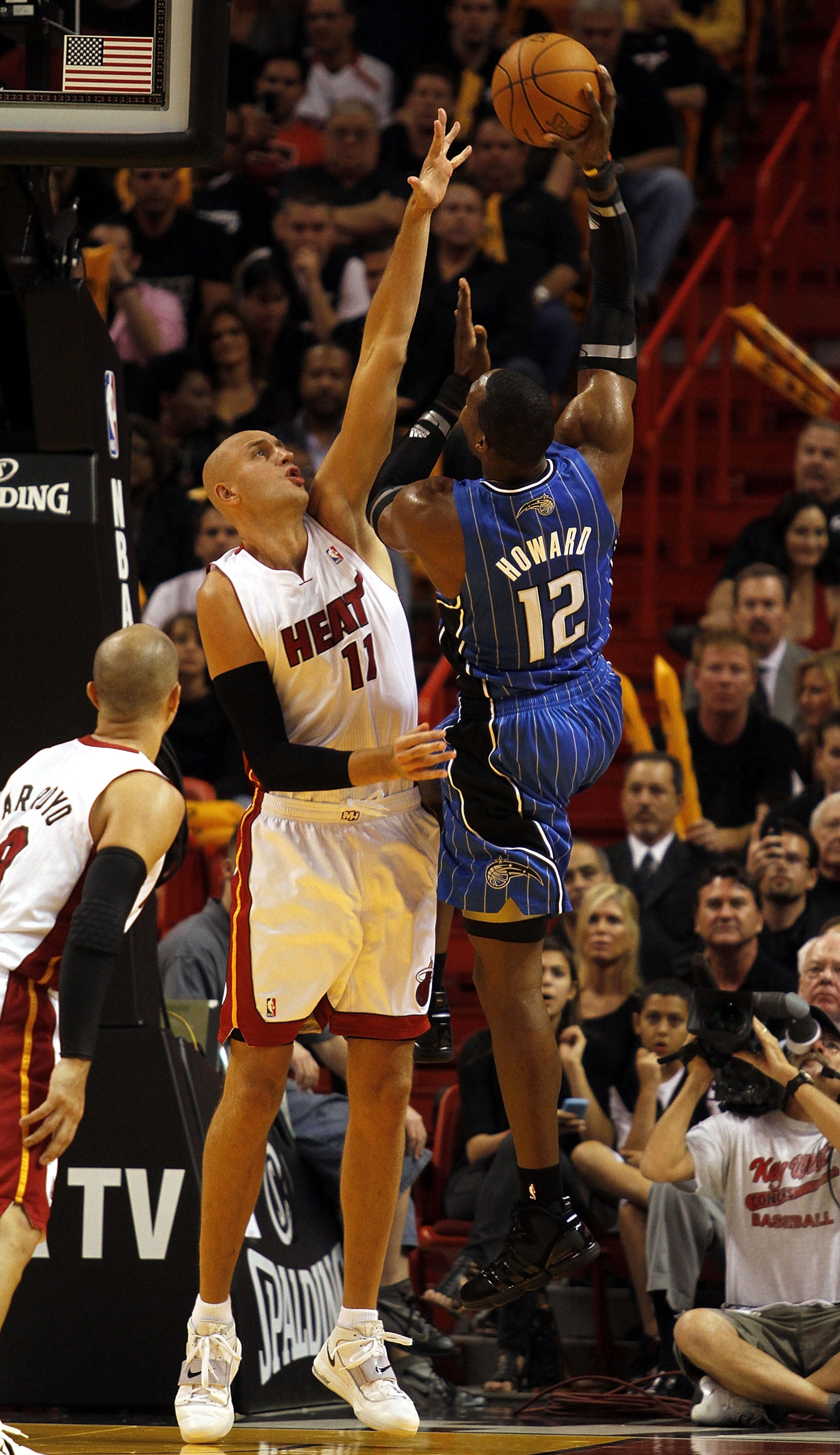 MIAMI - OCTOBER 29:  Center Dwight Howard #12 of the Orlando Magic is defended by Center Zydrunas Ilgauskas #11 of the Miami Heat at American Airlines Arena on October 29, 2010 in Miami, Florida.  NOTE TO USER: User expressly acknowledges and agrees that,