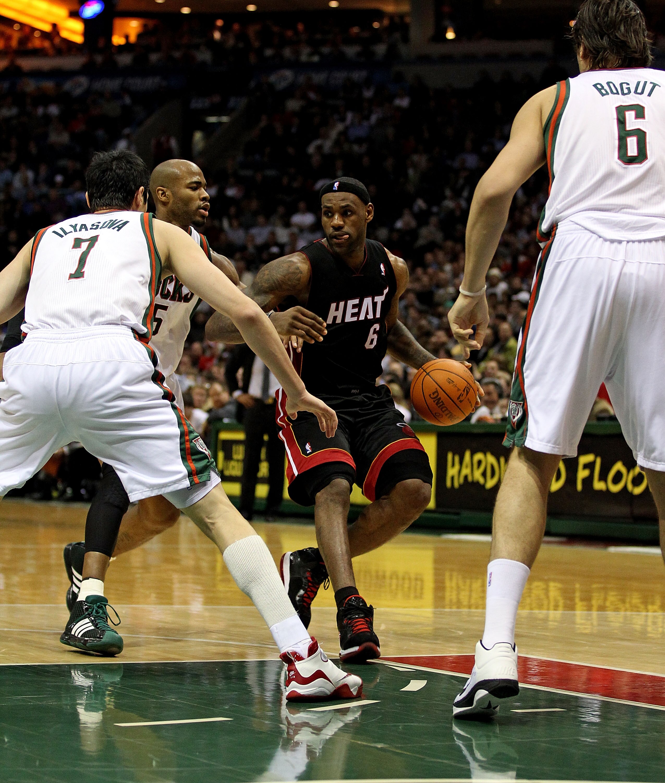 MILWAUKEE, WI - DECEMBER 06: LeBron James #6 of the Miami Heat moves between Ersan Ilyasova #7, Corey Maggette #5 and Andrew Bogut #6 of the Milwaukee Bucks at the Bradley Center on December 6, 2010 in Milwaukee, Wisconsin. The Heat defeated the Bucks 88-