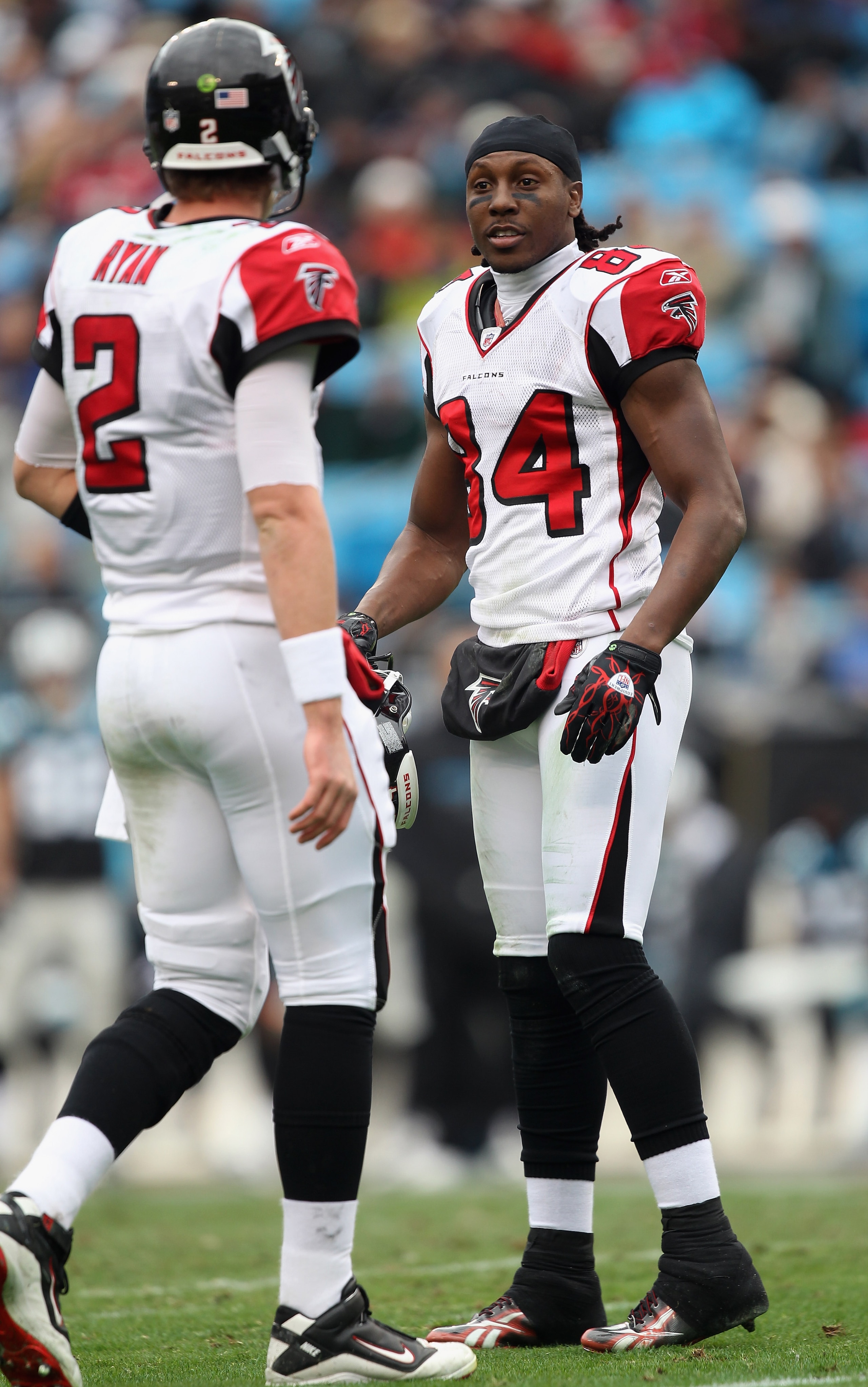 CHARLOTTE, NC - DECEMBER 12:  Teammates Matt Ryan #2 and Roddy White #84 of the Atlanta Falcons talk during a timeout against the Carolina Panthers during their game at Bank of America Stadium on December 12, 2010 in Charlotte, North Carolina.  (Photo by