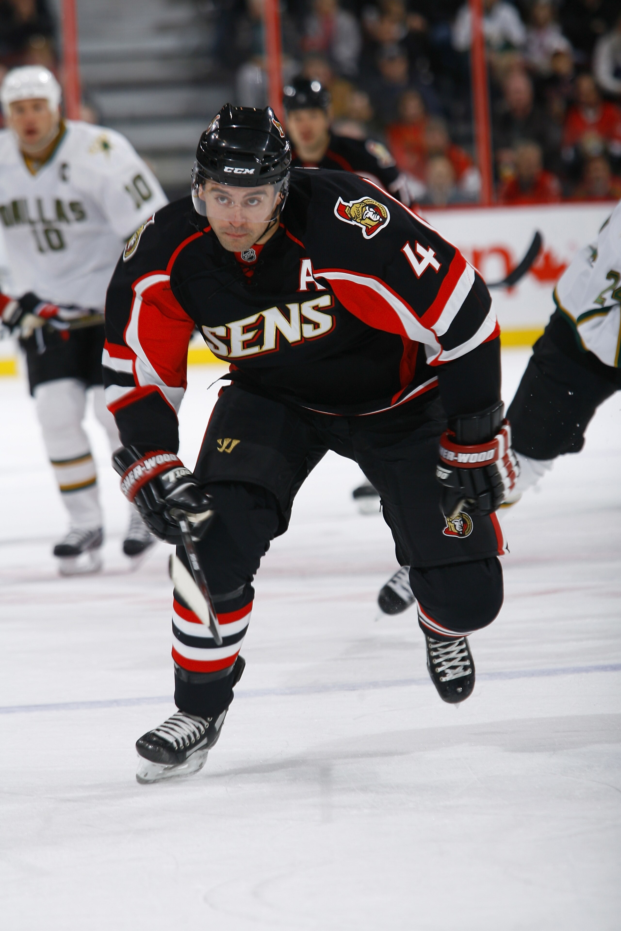 OTTAWA, ON - NOVEMBER 24: Chris Phillips #4 of the Ottawa Senators skates hard into his zone in a game against the Dallas Stars at Scotiabank Place on November 24, 2010 in Ottawa, Ontario, Canada. (Photo by Phillip MacCallum/Getty Images)