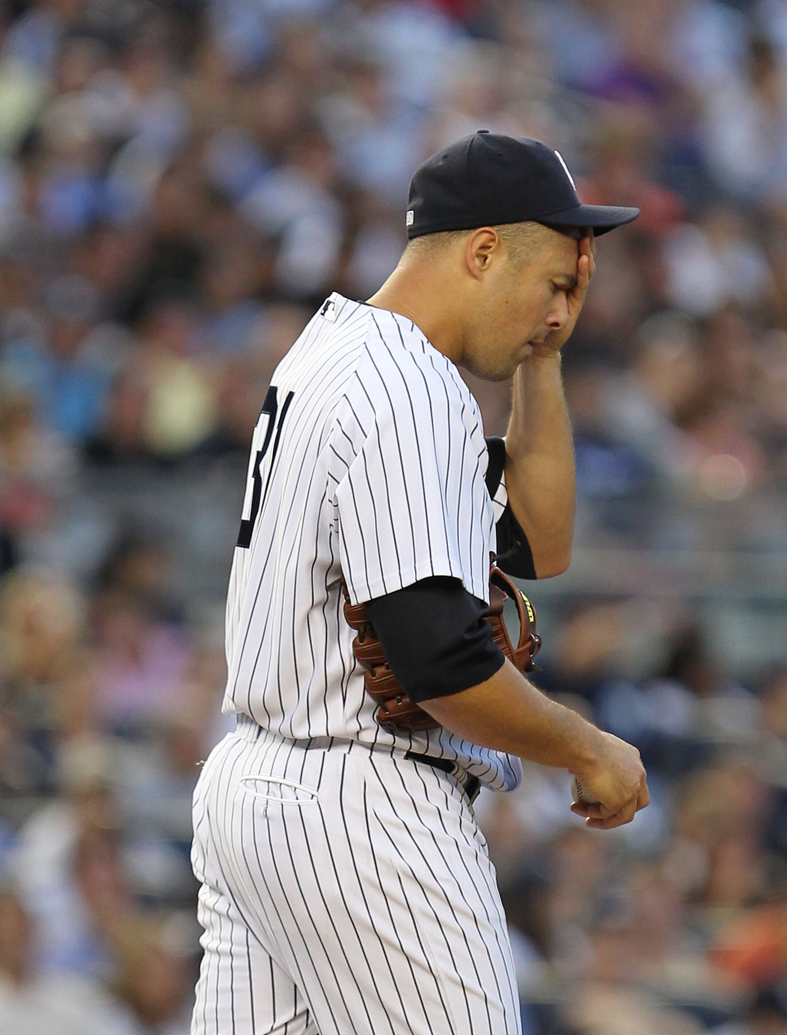 NEW YORK - AUGUST 06:  Javier Vasquez #31 of the New York Yankees reacts after giving up two runs by a double by Marco Scutaro of the Boston Red Sox during their game on August 6, 2010 at Yankee Stadium in the Bronx borough of New York City.  (Photo by Al