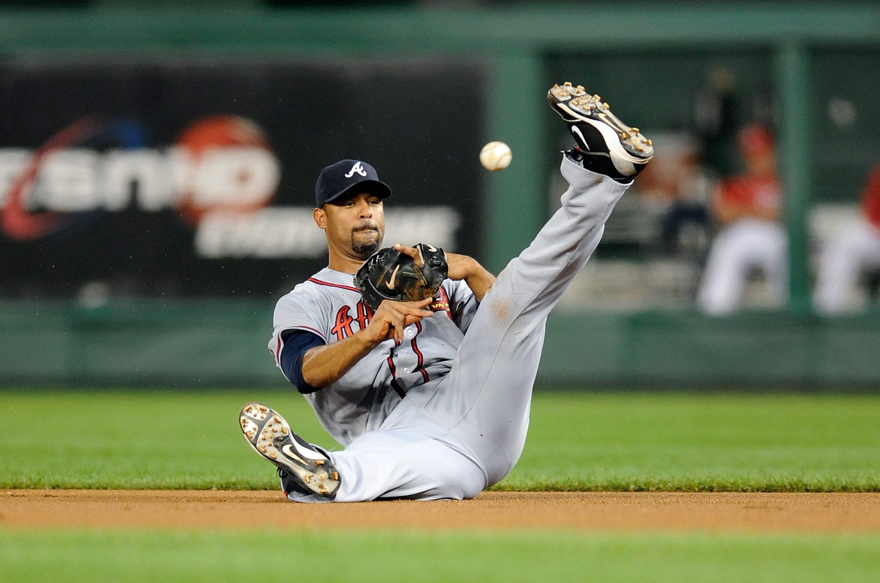 WASHINGTON - SEPTEMBER 24:  Derrek Lee #27 of the Atlanta Braves throws the ball to first base during the game against the Washington Nationals at Nationals Park on September 24, 2010 in Washington, DC.  (Photo by Greg Fiume/Getty Images)