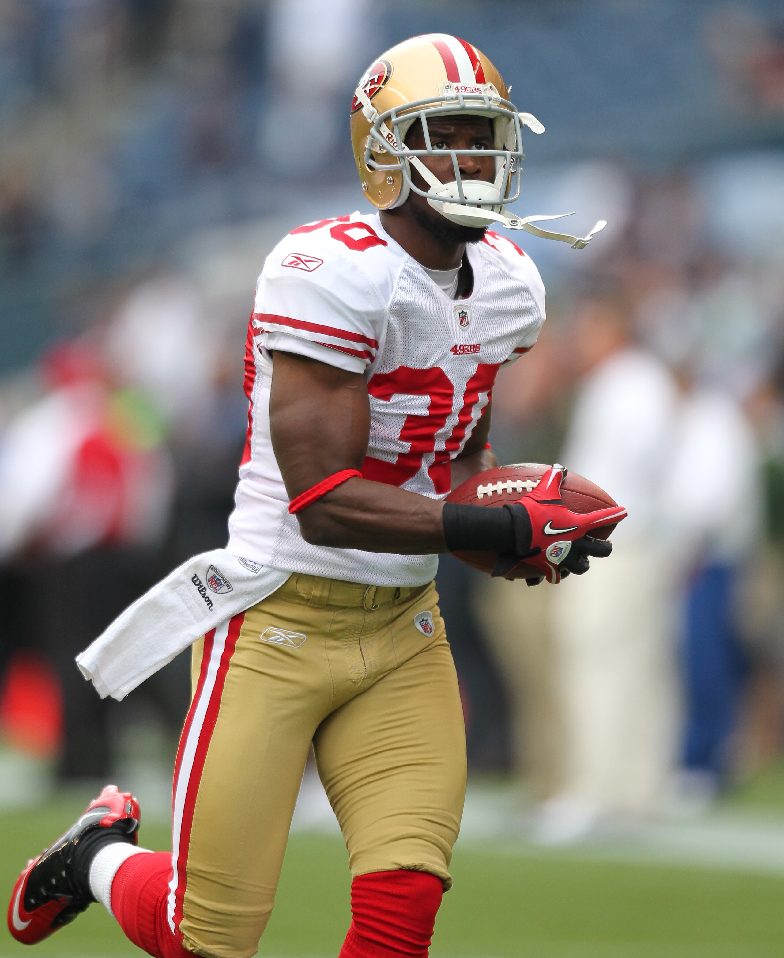 SEATTLE - SEPTEMBER 12:  Safety Reggie Smith #30 of the San Francisco 49ers warms up prior to the NFL season opener against the Seattle Seahawks at Qwest Field on September 12, 2010 in Seattle, Washington. (Photo by Otto Greule Jr/Getty Images)
