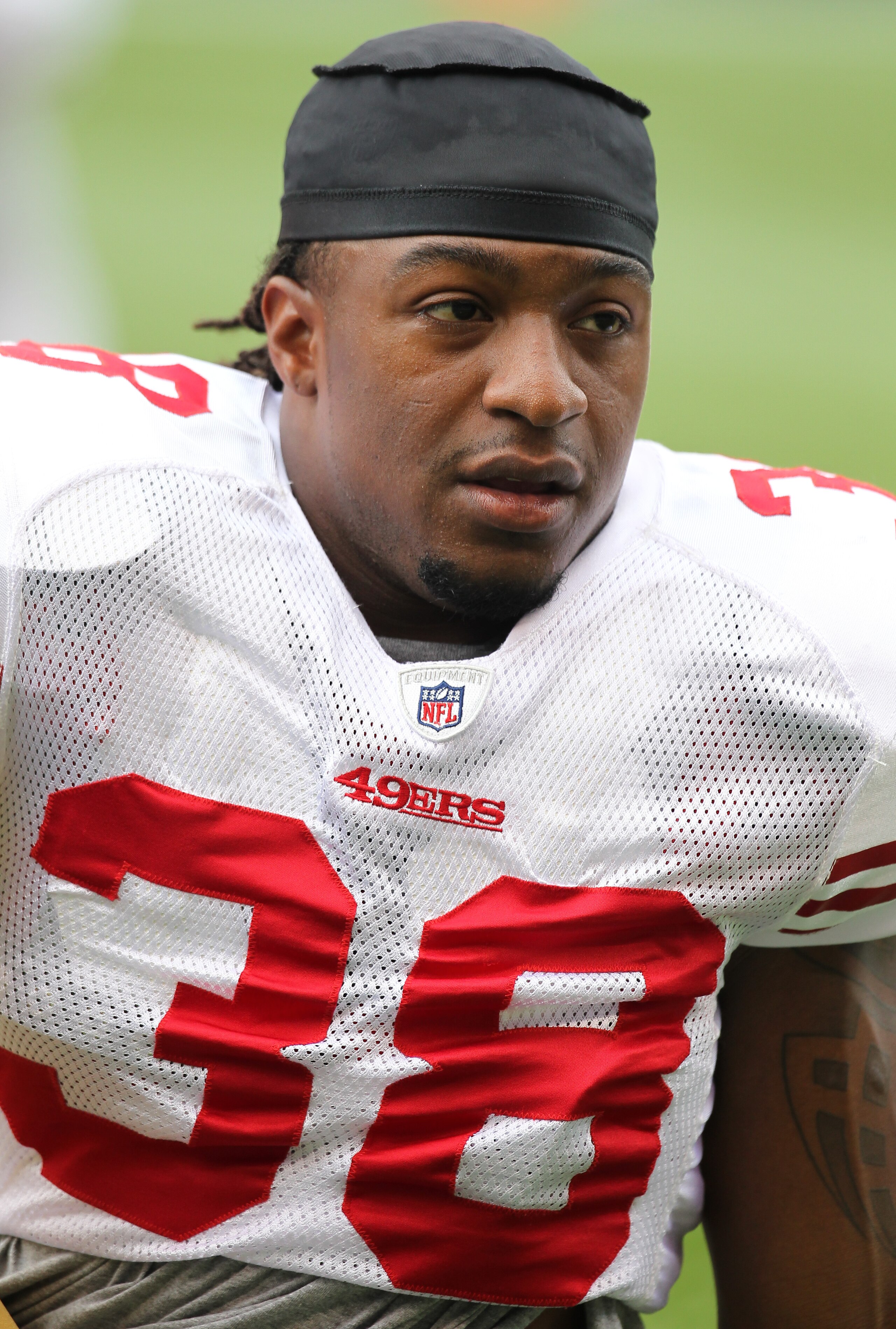 SEATTLE - SEPTEMBER 12:  Safety Dashon Goldson #38 of the San Francisco 49ers looks on during warm ups prior to the NFL season opener against the Seattle Seahawks at Qwest Field on September 12, 2010 in Seattle, Washington. (Photo by Otto Greule Jr/Getty