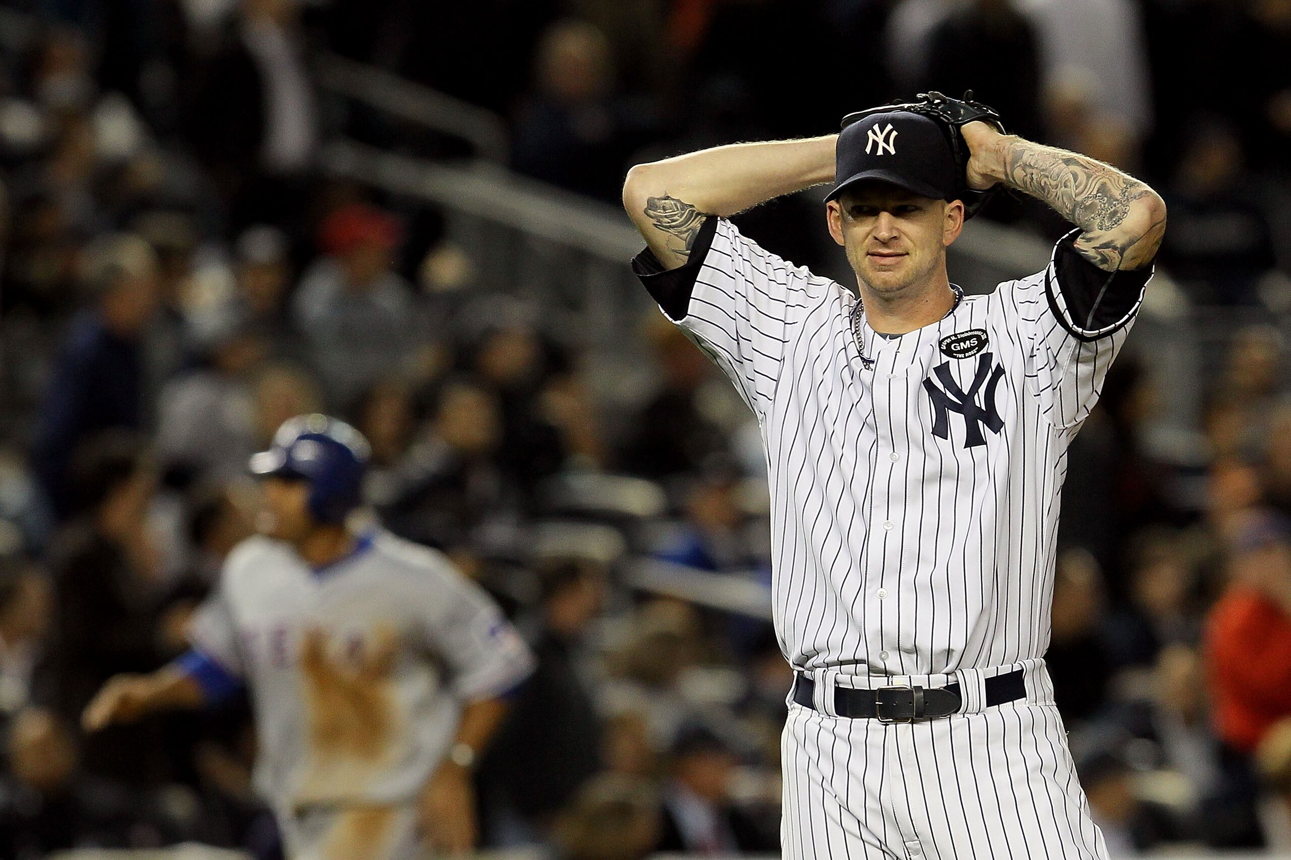 NEW YORK - OCTOBER 19:  A.J. Burnett #34 of the New York Yankees reacts after giving up a three-run home run to Bengie Molina #11 of the Texas Rangers in the top of the sixth inning in Game Four of the ALCS during the 2010 MLB Playoffs at Yankee Stadium o
