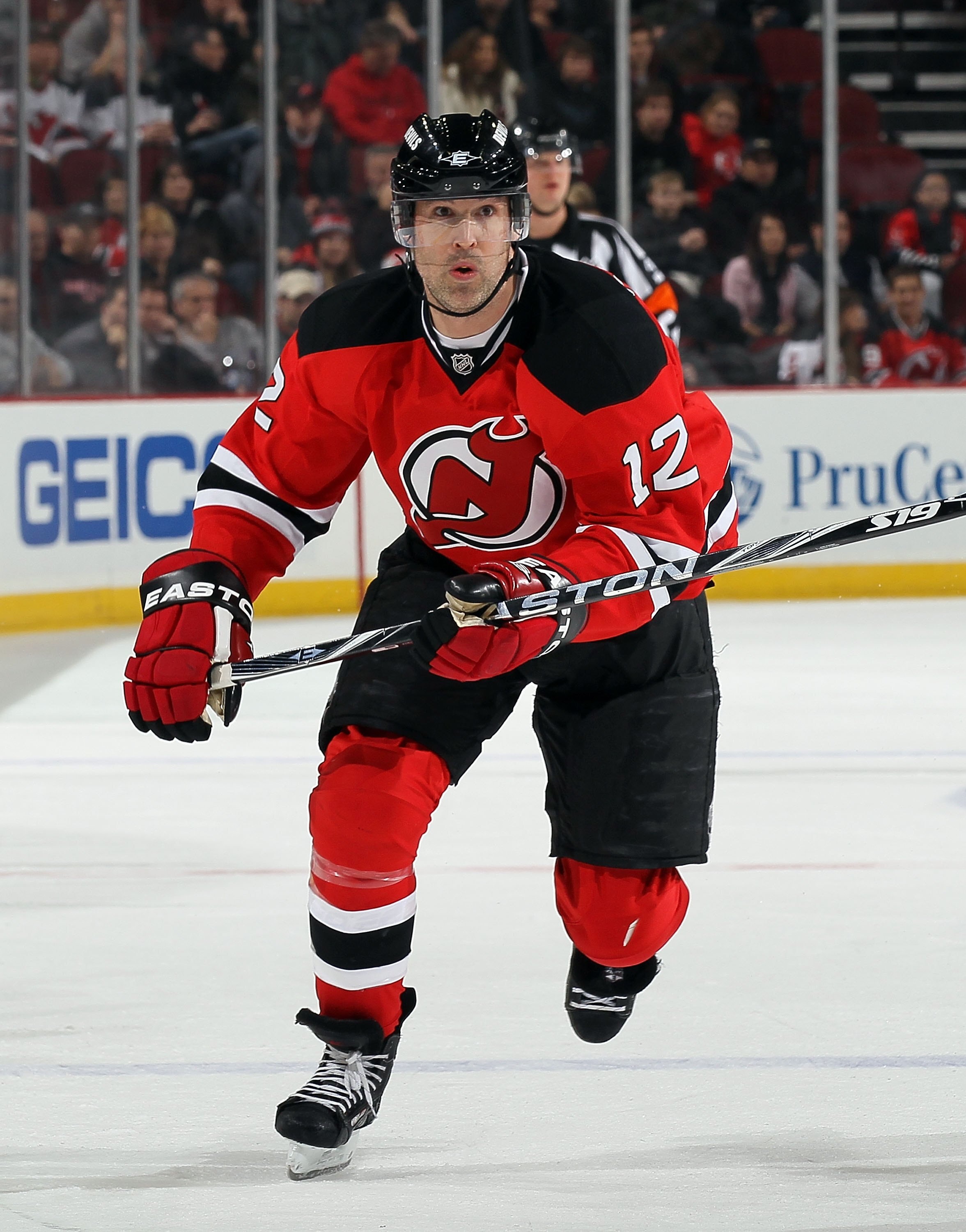 NEWARK, NJ - DECEMBER 23:  Brian Rolston #12 of the New Jersey Devils skates against the New York Islanders at the Prudential Center on December 23, 2010 in Newark, New Jersey. The Isles defeated the Devils 5-1.  (Photo by Jim McIsaac/Getty Images)