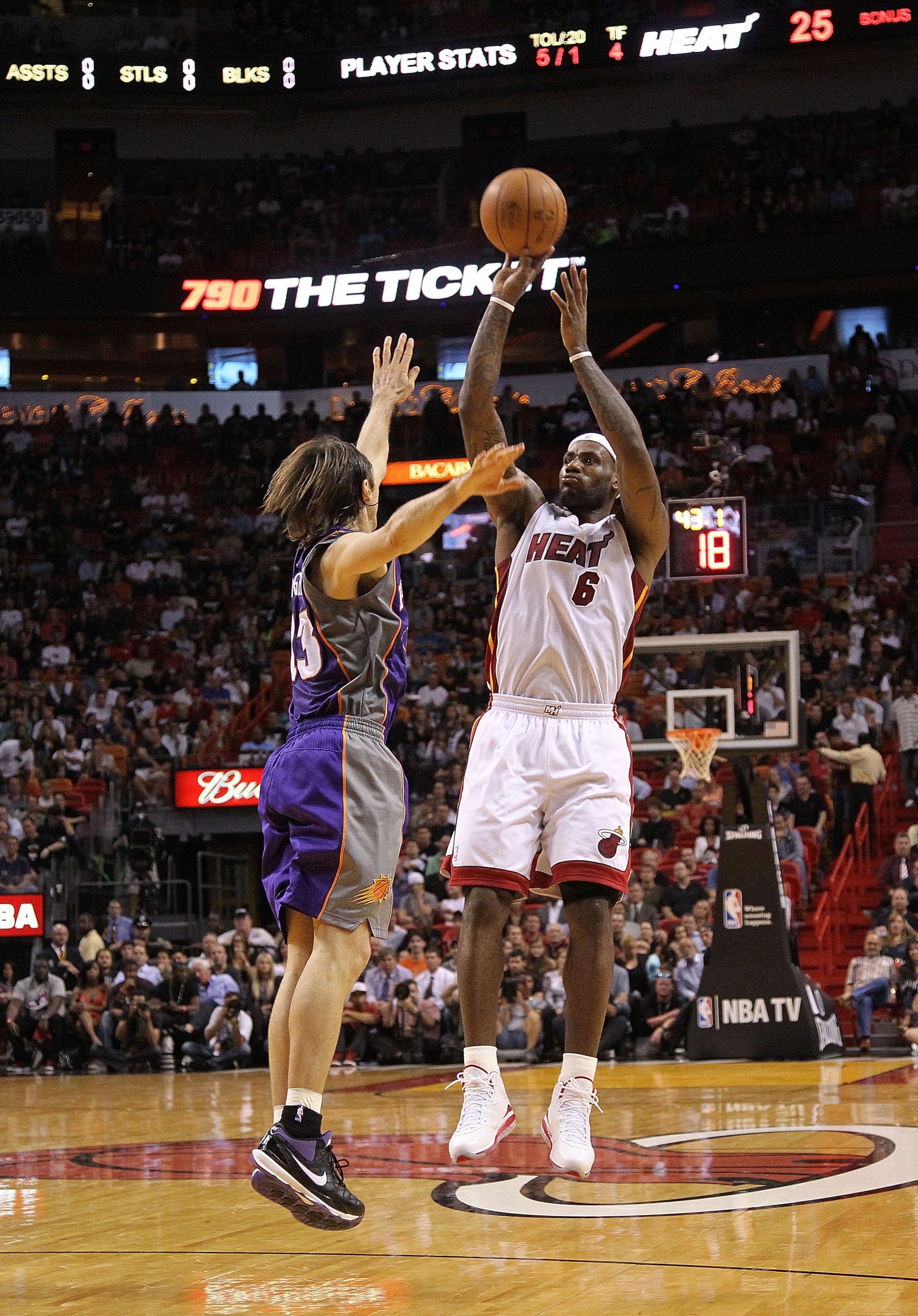 MIAMI - NOVEMBER 17:  LeBron James #6 of the Miami Heat shoots over Steve Nash #13 during a game against the Phoenix Suns at American Airlines Arena on November 17, 2010 in Miami, Florida. NOTE TO USER: User expressly acknowledges and agrees that, by down