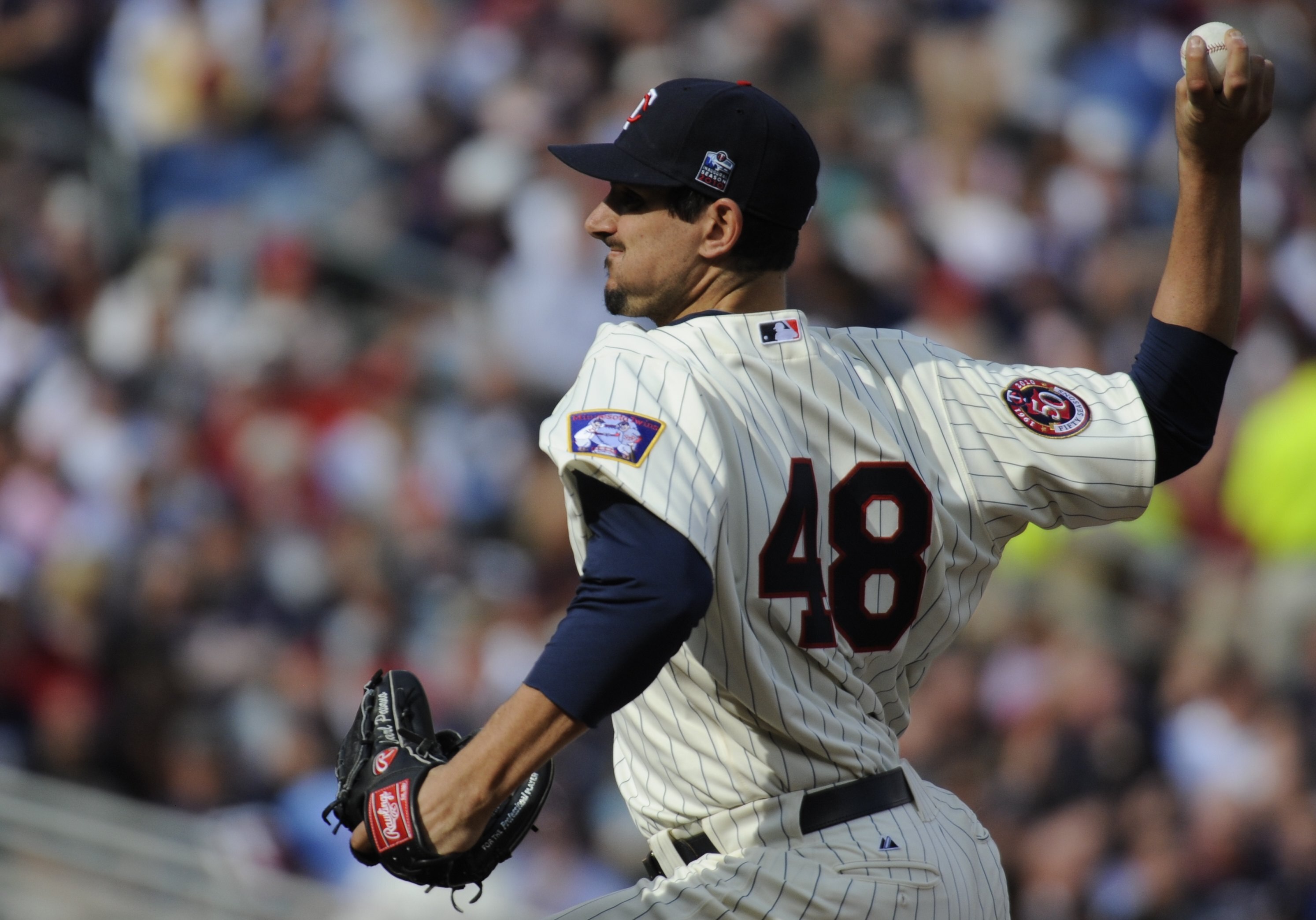 MINNEAPOLIS, MN - APRIL 12: Carl Pavano #48 of the Minnesota Twins pitches in the fourth inning against the Boston Red Sox during the Twins home opener at Target Field on April 12, 2010 in Minneapolis, Minnesota. (Photo by Hannah Foslien /Getty Images)