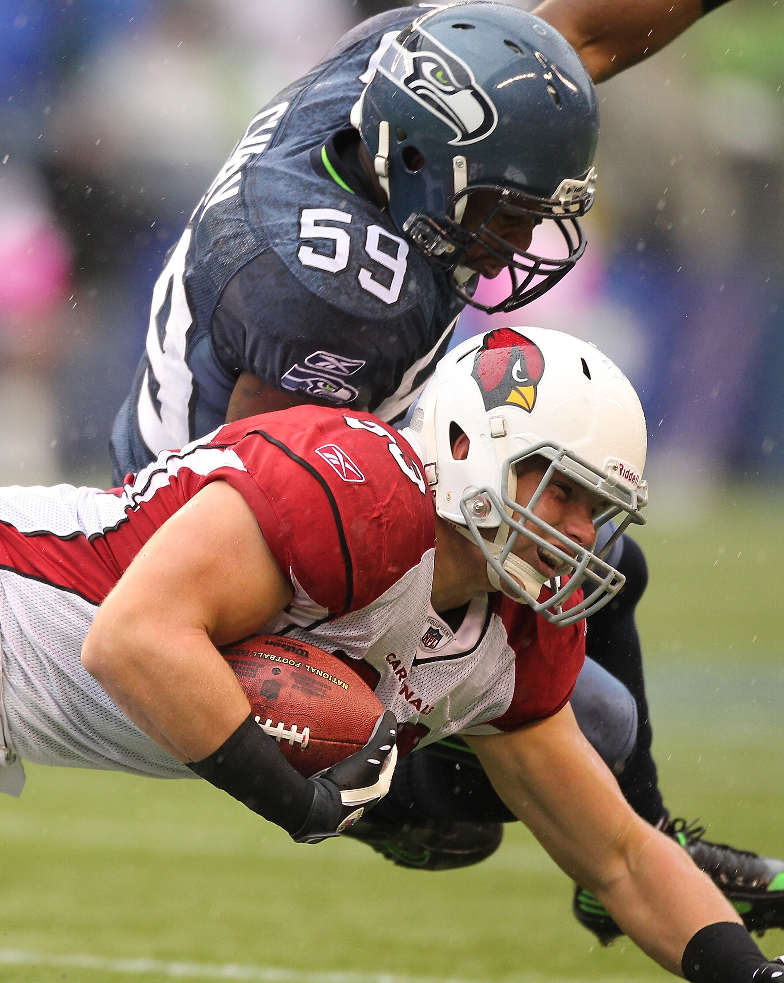 SEATTLE - OCTOBER 24: Tight end Stephen Spach #83 of the Arizona Cardinals is tackled by Aaron Curry #59 of the Seattle Seahawks at Qwest Field on October 24, 2010 in Seattle, Washington. The Seahawks defeated the Cardinals 22-10. (Photo by Otto Greule J SEATTLE - OCTOBER 24: Tight end Stephen Spach #83 of the Arizona Cardinals is tackled by Aaron Curry #59 of the Seattle Seahawks at Qwest Field on October 24, 2010 in Seattle, Washington. The Seahawks defeated the Cardinals 22-10. (Photo by Otto Greule J