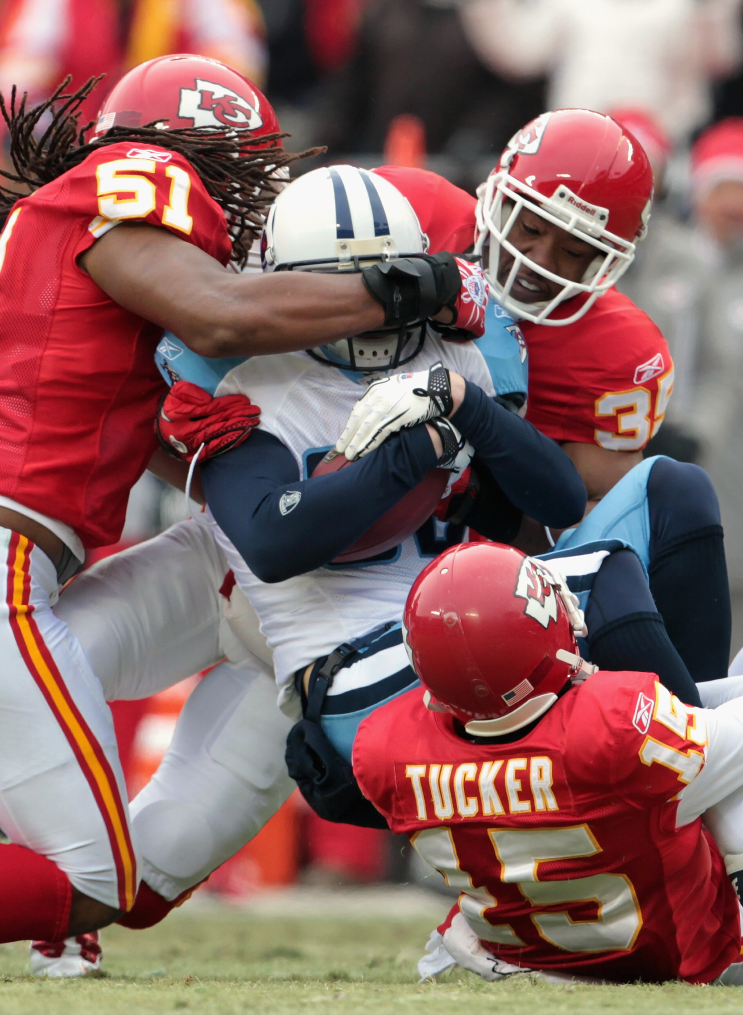 KANSAS CITY, MO - DECEMBER 26: Marc Mariani #83 of the Tennessee Titans is tackled by Corey Mays #51, Ricky Price #35, and Verran Tucker #15 of the Kansas City Chiefs during the game on December 26, 2010 at Arrowhead Stadium in Kansas City, Missouri. (P KANSAS CITY, MO - DECEMBER 26: Marc Mariani #83 of the Tennessee Titans is tackled by Corey Mays #51, Ricky Price #35, and Verran Tucker #15 of the Kansas City Chiefs during the game on December 26, 2010 at Arrowhead Stadium in Kansas City, Missouri. (P