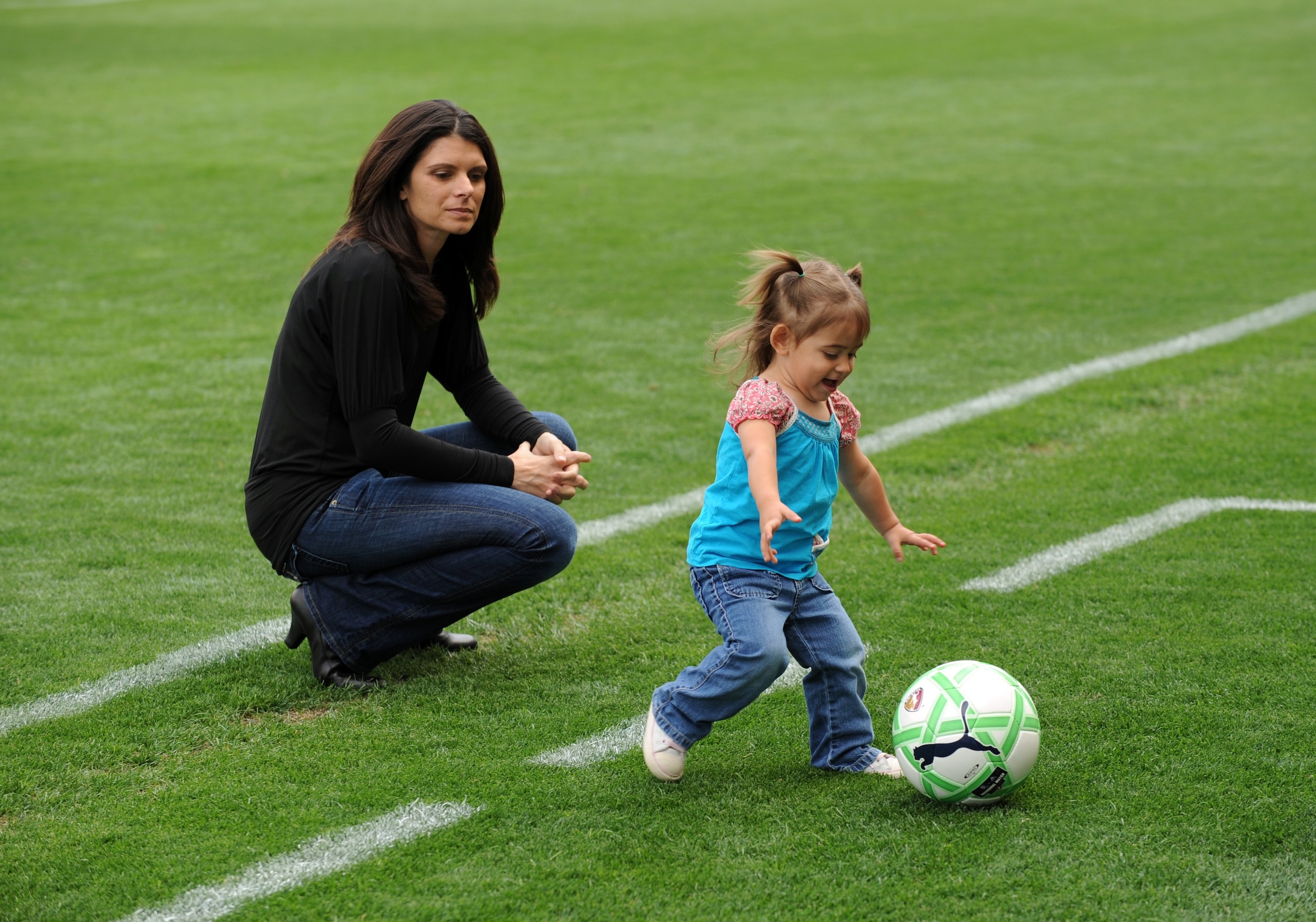 CARSON, CA - MARCH 29: Mia Hamm watches her daughter play with a ball prior to the match between the Washington Freedom and the Los Angeles Sol at The Home Depot Center on March 29, 2009 in Carson, California. The Sol defeated the Freedom 2-0. (Photo by CARSON, CA - MARCH 29: Mia Hamm watches her daughter play with a ball prior to the match between the Washington Freedom and the Los Angeles Sol at The Home Depot Center on March 29, 2009 in Carson, California. The Sol defeated the Freedom 2-0. (Photo by