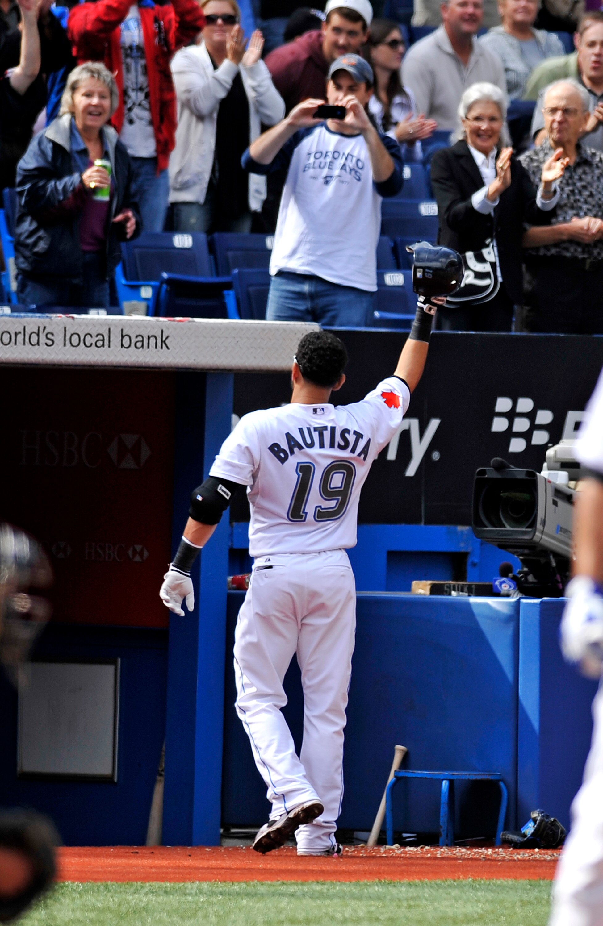 TORONTO - SEPTEMBER 23:   Jose Bautista #19 of the Toronto Blue Jays tips his hat to the crowd after hitting his 50th home run of the season during game action against the Seattle Mariners September 23, 2010 at Rogers Centre in Toronto, Ontario, Canada. (