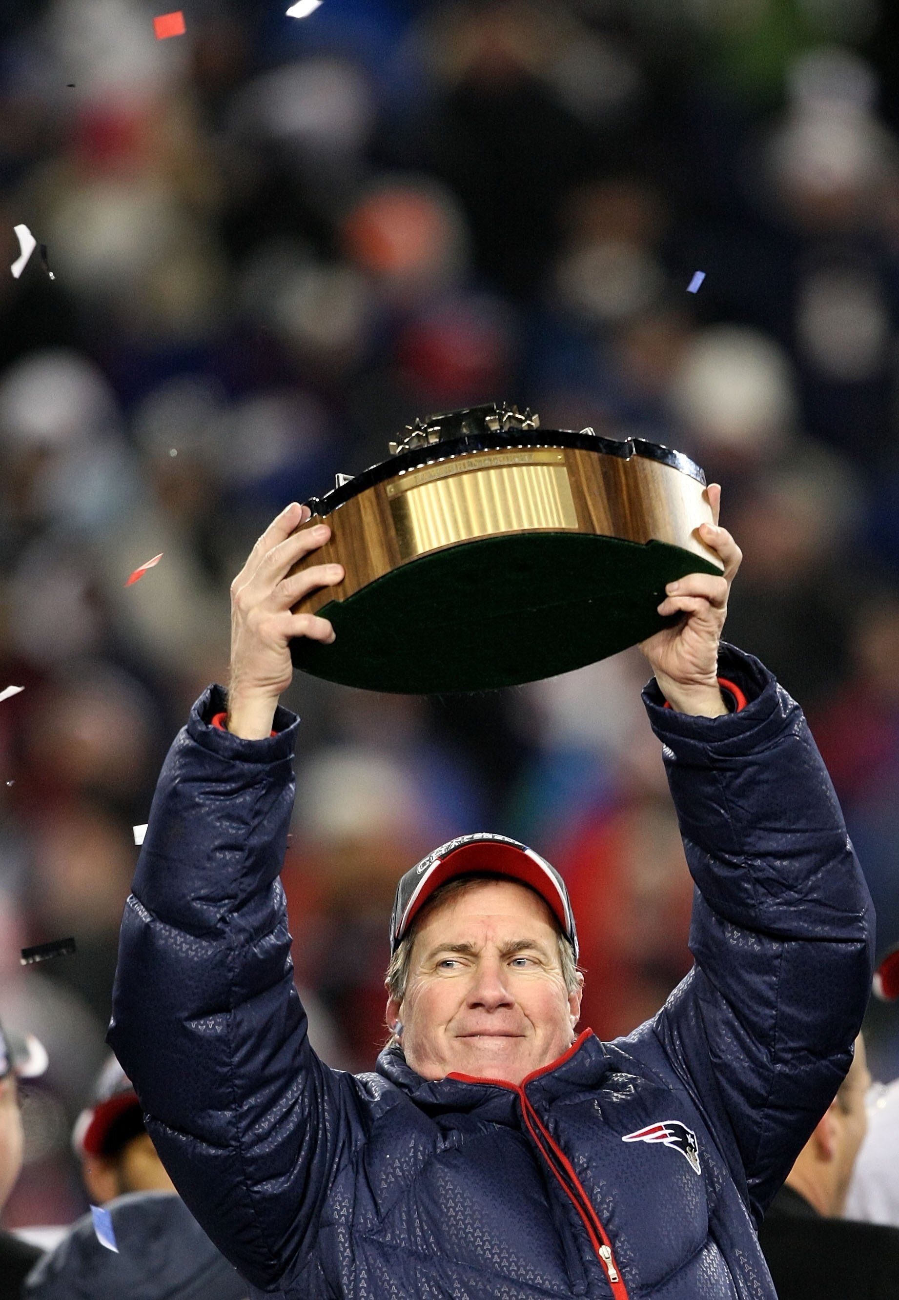 FOXBORO, MA - JANUARY 20:  Head coach Bill Belichick of the New England Patriots celebrates with the Lamar Hunt Trophy after the Patriots 21-12 win against the San Diego Chargers during the AFC Championship Game on January 20, 2008 at Gillette Stadium in