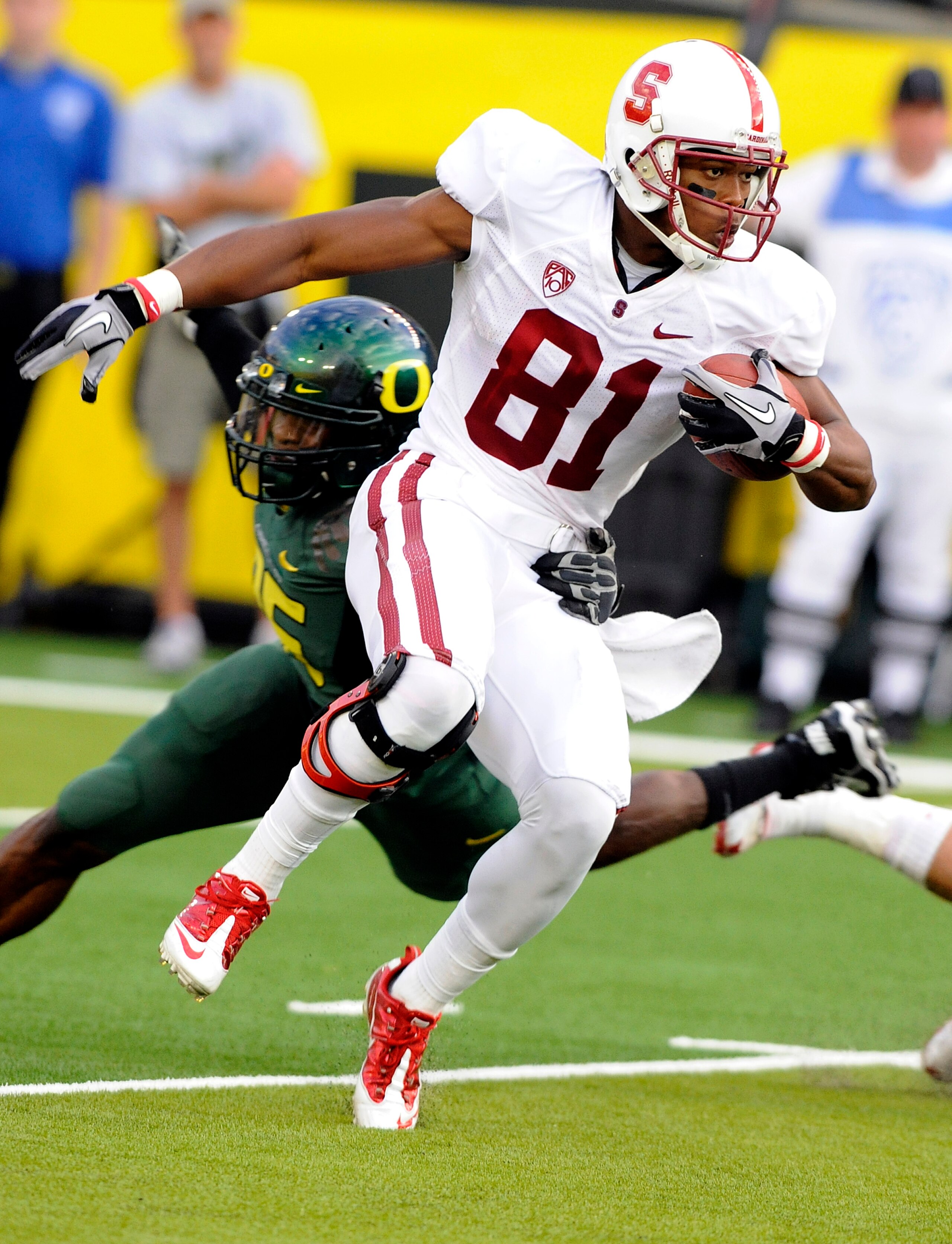 EUGENE, OR - OCTOBER 2: Wide receiver Chris Owusu #81 of the Stanford Cardinal looks for some running room as he returns a kick in the second quarter of the game against the Oregon Ducks at Autzen Stadium on October 2, 2010 in Eugene, Oregon. Oregon won EUGENE, OR - OCTOBER 2: Wide receiver Chris Owusu #81 of the Stanford Cardinal looks for some running room as he returns a kick in the second quarter of the game against the Oregon Ducks at Autzen Stadium on October 2, 2010 in Eugene, Oregon. Oregon won