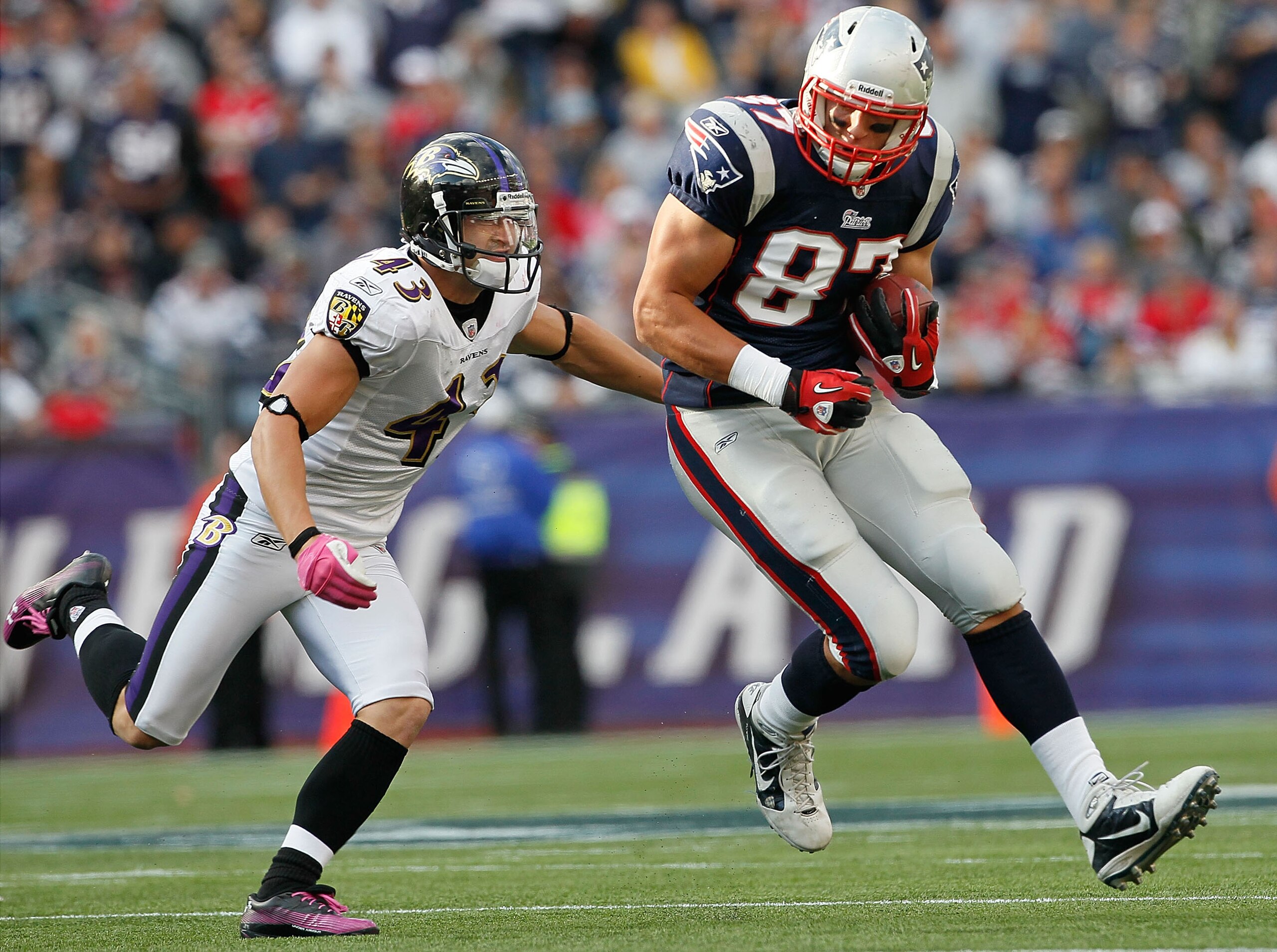 FOXBORO, MA - OCTOBER 17:  Rob Gronkowski #87 of the New England Patriots gains yards as he is chased by Haruki Nakamura #43 of the Baltimore Ravens at Gillette Stadium on October 17, 2010 in Foxboro, Massachusetts. (Photo by Jim Rogash/Getty Images)