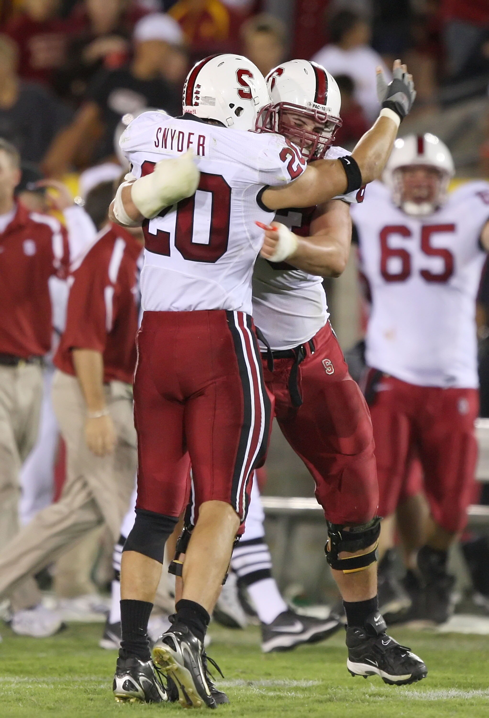 LOS ANGELES - OCTOBER 6:  (L-R) Clinton Snyder #20 and Chris Marinelli #63 of the Stanford University Cardinal celebrate defeating the USC Trojans 24-23 at the Los Angeles Memorial Coliseum October 6, 2007 in Los Angeles, California.  (Photo by Lisa Blume