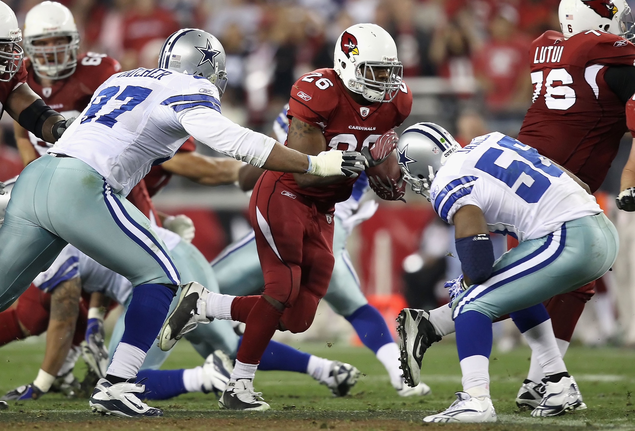 GLENDALE, AZ - DECEMBER 25: Runningback Beanie Wells #26 of the Arizona Cardinals rushes the football against the Dallas Cowboys during the NFL game at the University of Phoenix Stadium on December 25, 2010 in Glendale, Arizona. The Cardinals defeated th GLENDALE, AZ - DECEMBER 25: Runningback Beanie Wells #26 of the Arizona Cardinals rushes the football against the Dallas Cowboys during the NFL game at the University of Phoenix Stadium on December 25, 2010 in Glendale, Arizona. The Cardinals defeated th