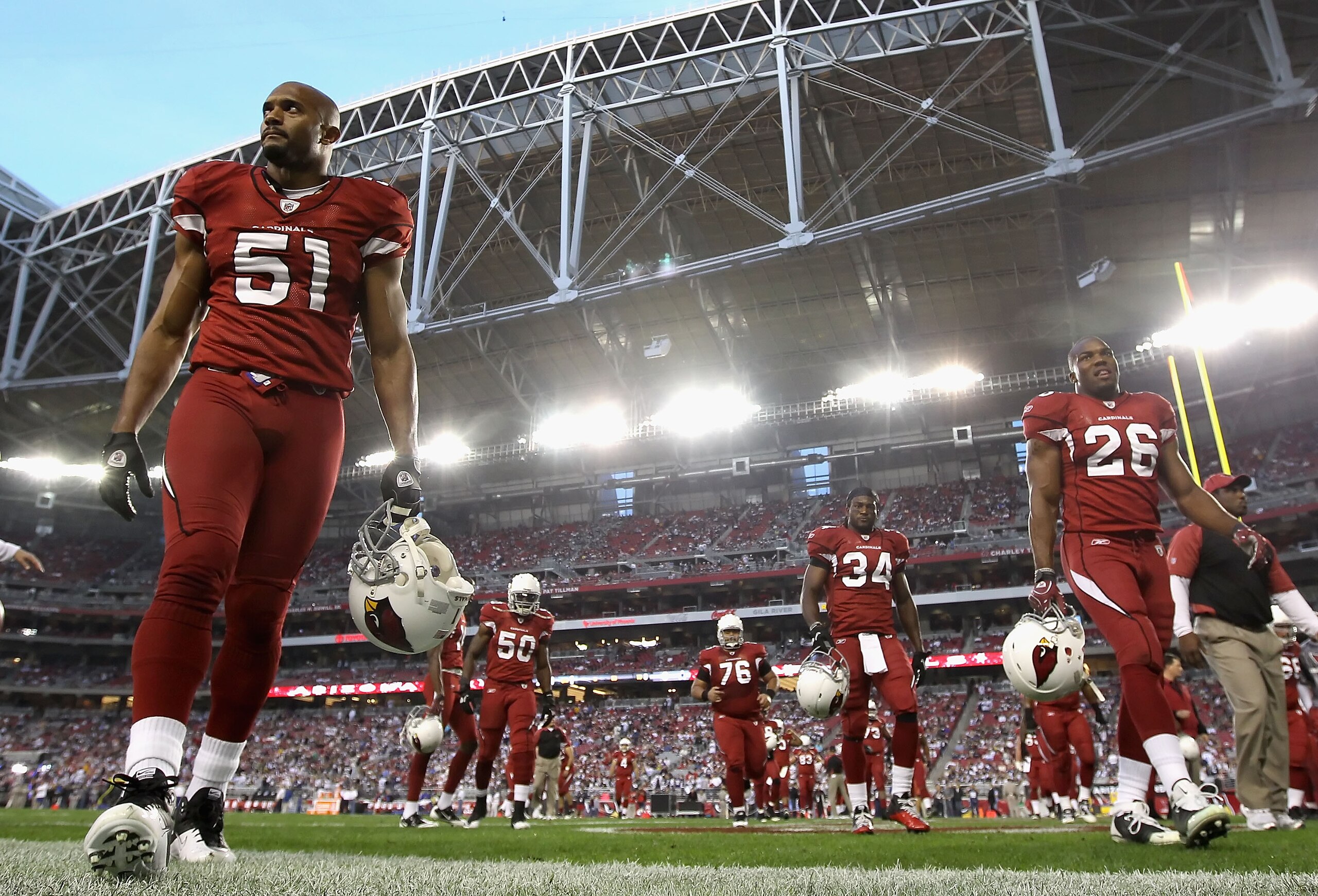 GLENDALE, AZ - DECEMBER 25: (L-R) Paris Lenon #51, O'Brien Schofield #50, Deuce Lutui #76, Tim Hightower #34 and Beanie Wells #26 of the Arizona Cardinals walk off the field following warm ups to the NFL game against the Dallas Cowboys at the University GLENDALE, AZ - DECEMBER 25: (L-R) Paris Lenon #51, O'Brien Schofield #50, Deuce Lutui #76, Tim Hightower #34 and Beanie Wells #26 of the Arizona Cardinals walk off the field following warm ups to the NFL game against the Dallas Cowboys at the University