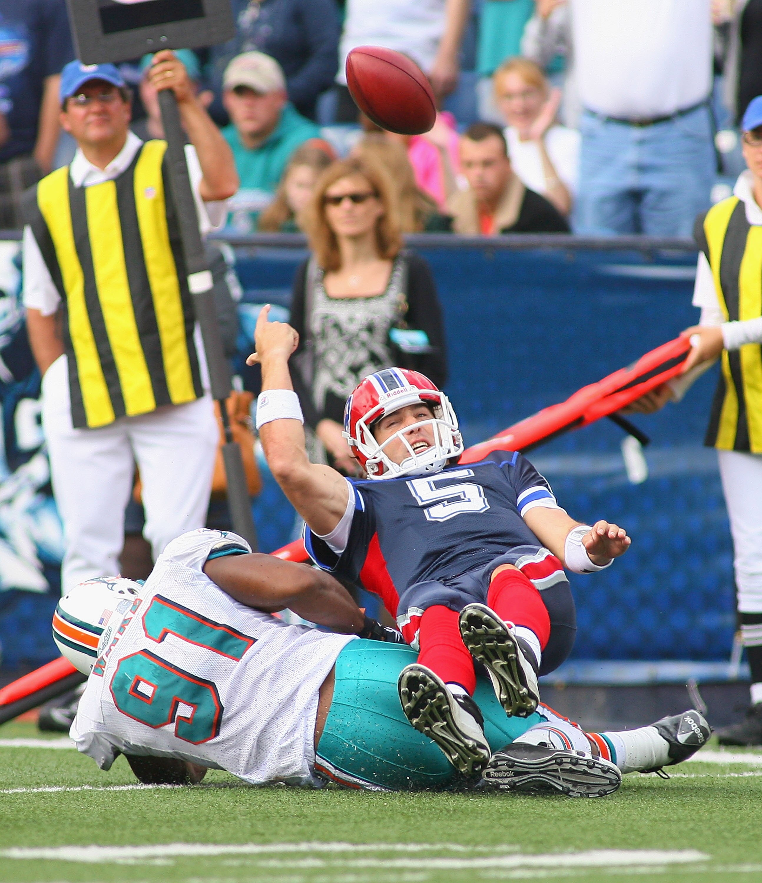 ORCHARD PARK, NY - SEPTEMBER 12: Trent Edwards #5 of the Buffalo Bills is sacked by Cameron Wake #91 of the Miami Dolphins during the NFL season opener at Ralph Wilson Stadium on September 12, 2010 in Orchard Park, New York. The Dolphins won 15-10. (Photo