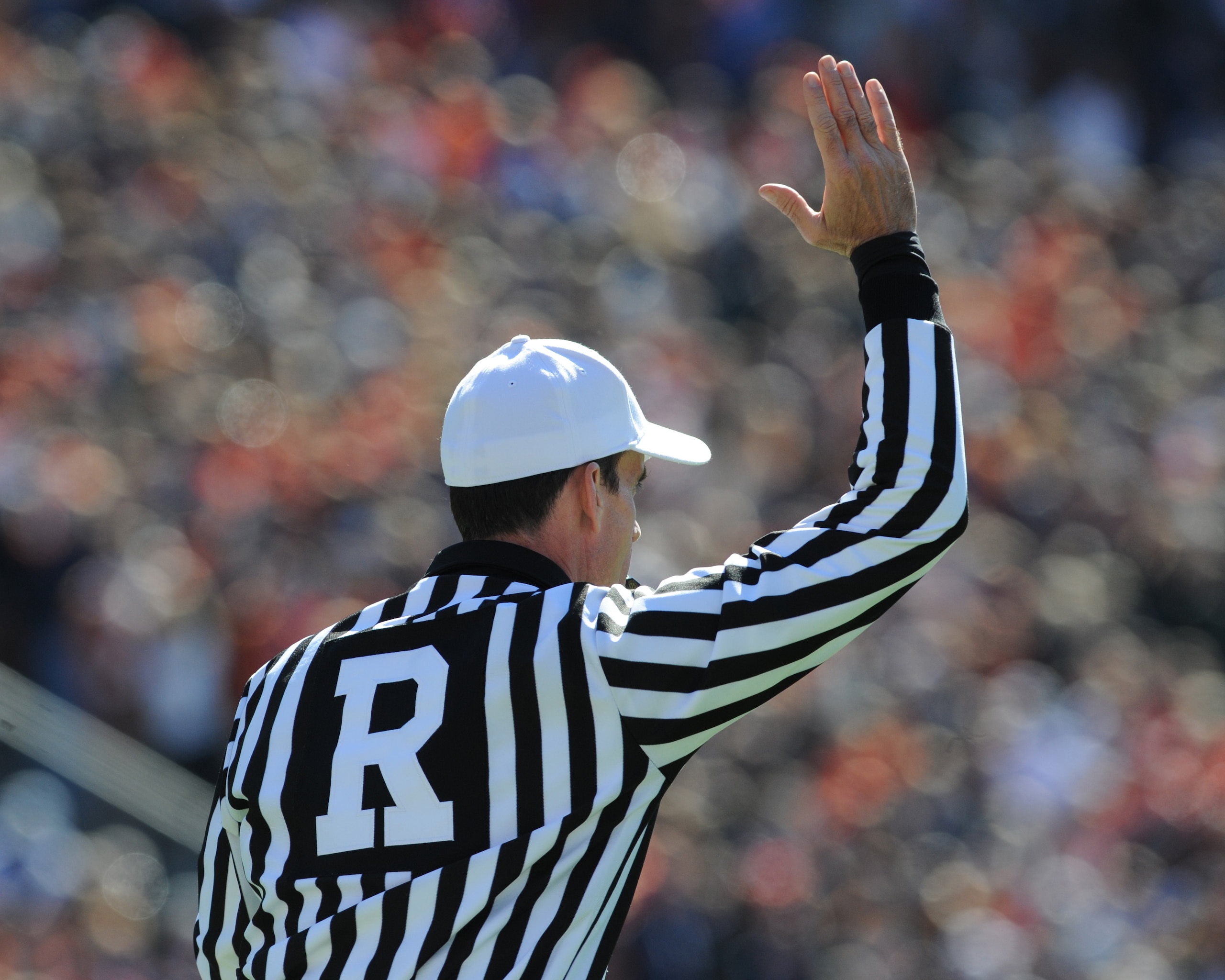 AUBURN, AL - NOVEMBER 06:  NCAA referee Ken Williamson signals the start of play as the Auburn Tigers play against the Chattanooga Mocs November 6, 2010 at Jordan-Hare Stadium in Auburn, Alabama.  (Photo by Al Messerschmidt/Getty Images)