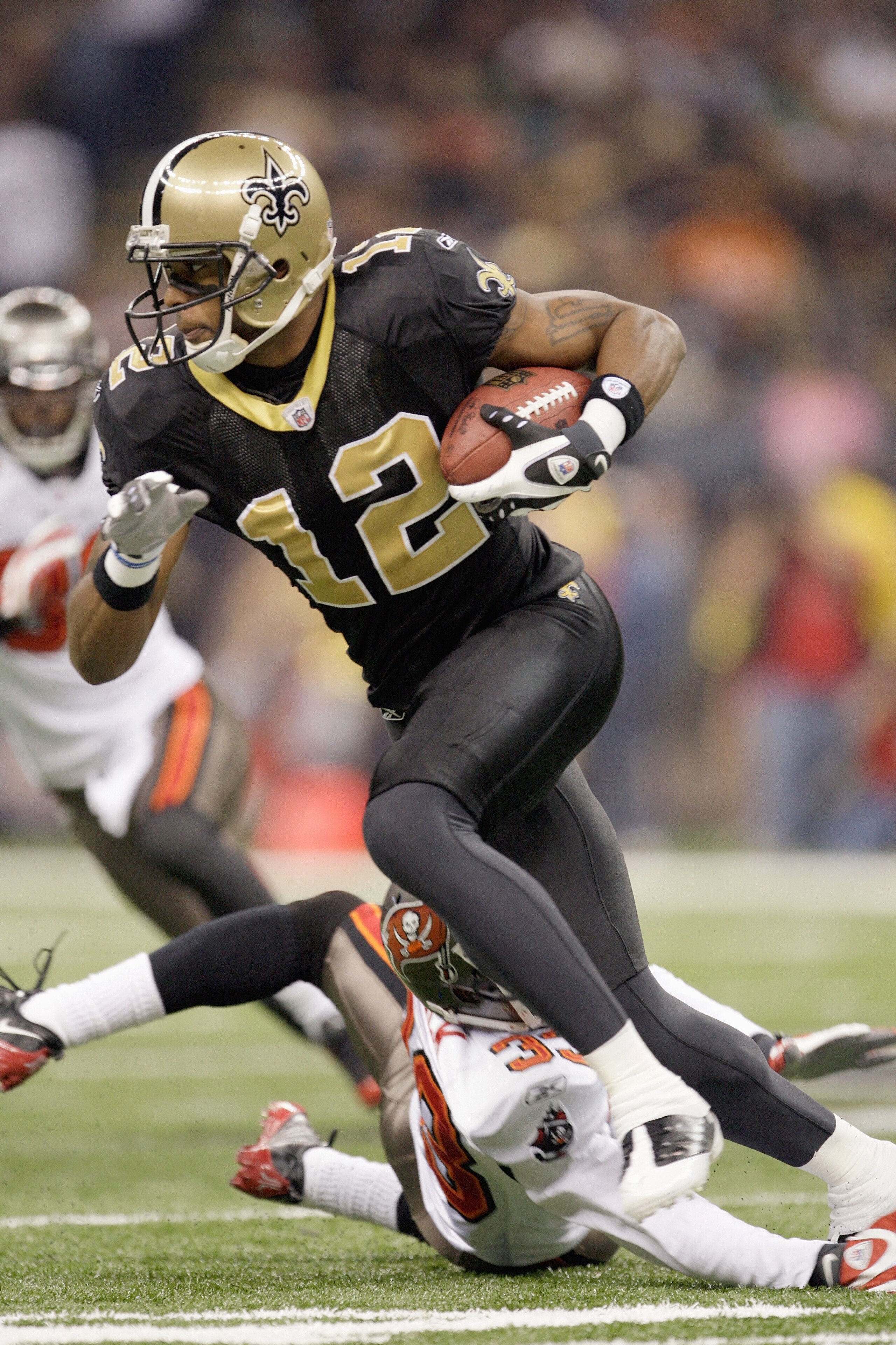 NEW ORLEANS - DECEMBER 27: Marques Colston #12 of the New Orleans Saints carries the ball during the game against the Tampa Bay Buccaneers on December 27, 2009 at Louisiana Superdome in New Orleans, Louisiana. (Photo by Jamie Squire/Getty Images) NEW ORLEANS - DECEMBER 27: Marques Colston #12 of the New Orleans Saints carries the ball during the game against the Tampa Bay Buccaneers on December 27, 2009 at Louisiana Superdome in New Orleans, Louisiana. (Photo by Jamie Squire/Getty Images)