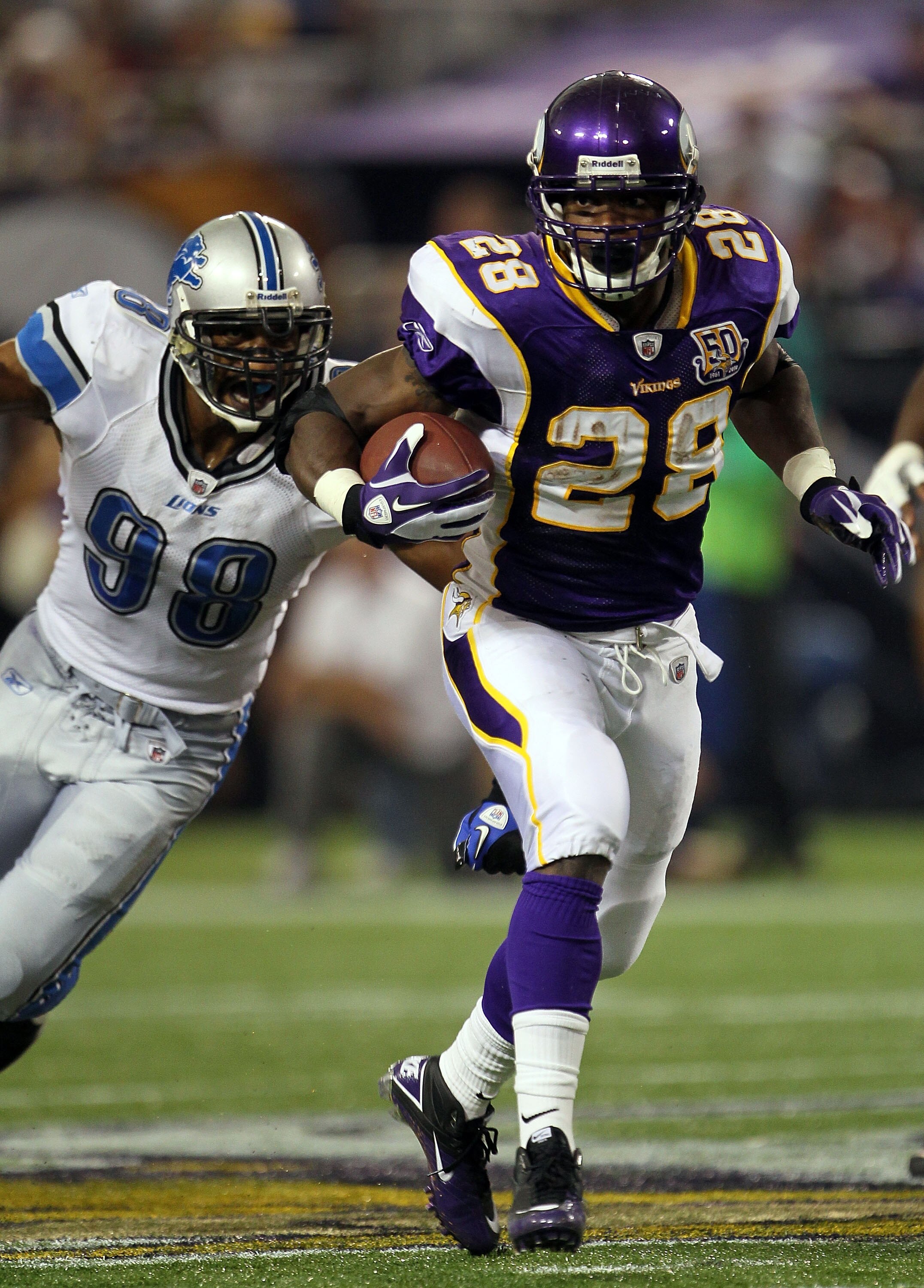 MINNEAPOLIS - SEPTEMBER 26:  Running back Adrian Peterson #28 of the Minnesota Vikings carries the ball against the Detroit Lions at Mall of America Field on September 26, 2010 in Minneapolis, Minnesota. The Vikings defeated the Lions 24-10.  (Photo by Je